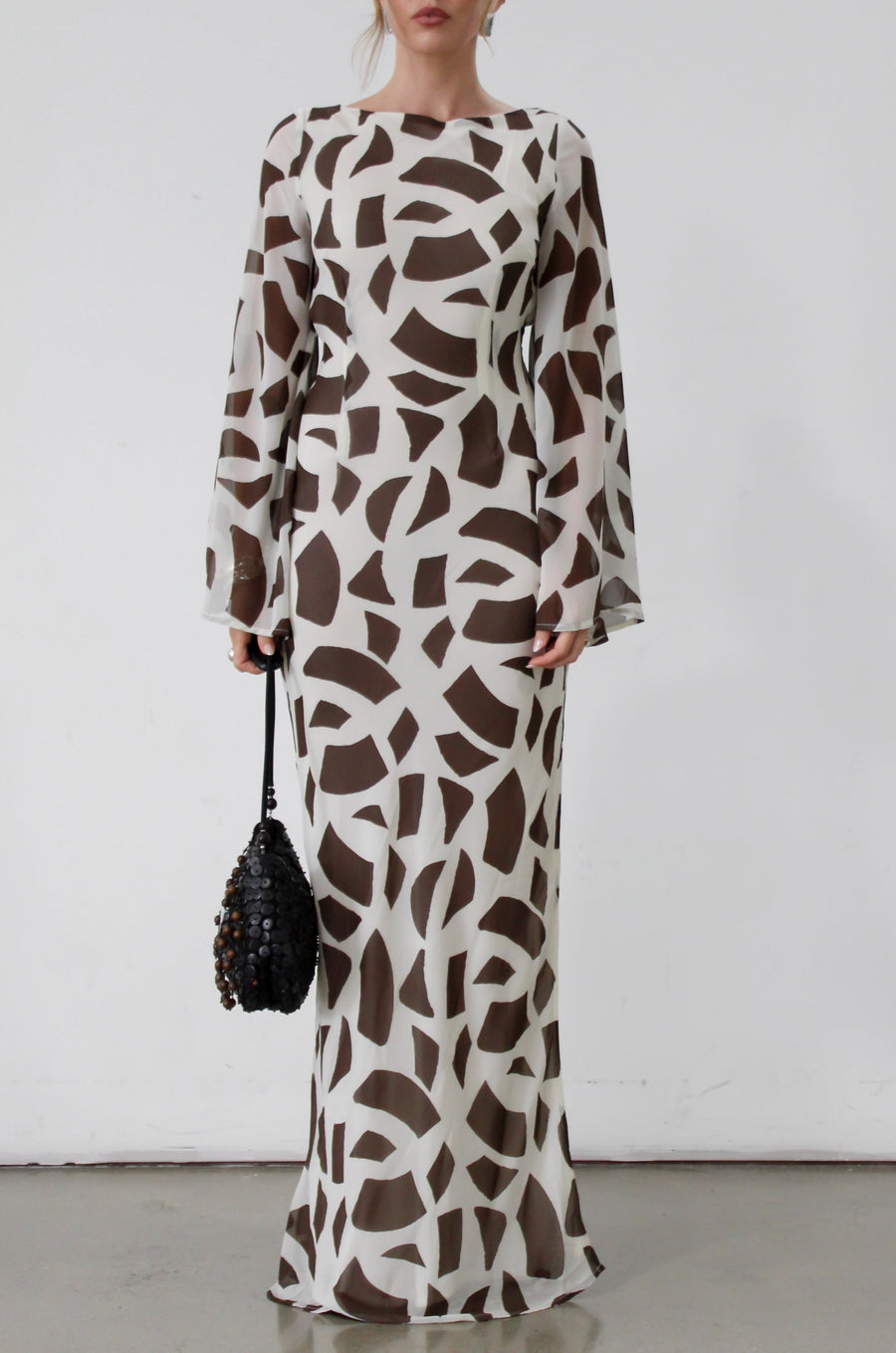 Printed chiffon maxi dress. Long bell sleeves. Adjustable crisscross back straps. Side slit. Fully lined. Dinner dress. Classy dinner dress. Fancy dinner dress. Nice dinner dress. Dressed up vacation outfits. Dress to wear on vacation. Nice dress to wear on vacation. Open back dress
