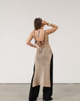 Metallic open knit crochet maxi dress. Fixed straps. Side slits. Low back. Unlined.