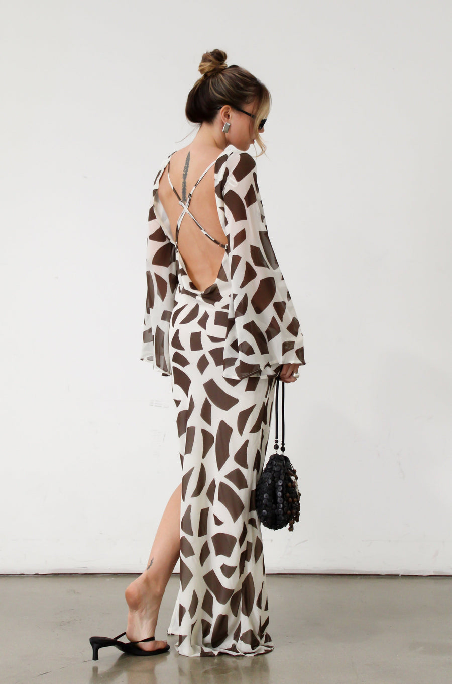 Printed chiffon maxi dress. Long bell sleeves. Adjustable crisscross back straps. Side slit. Fully lined. Dinner dress. Classy dinner dress. Fancy dinner dress. Nice dinner dress. Dressed up vacation outfits. Dress to wear on vacation. Nice dress to wear on vacation. Open back dress