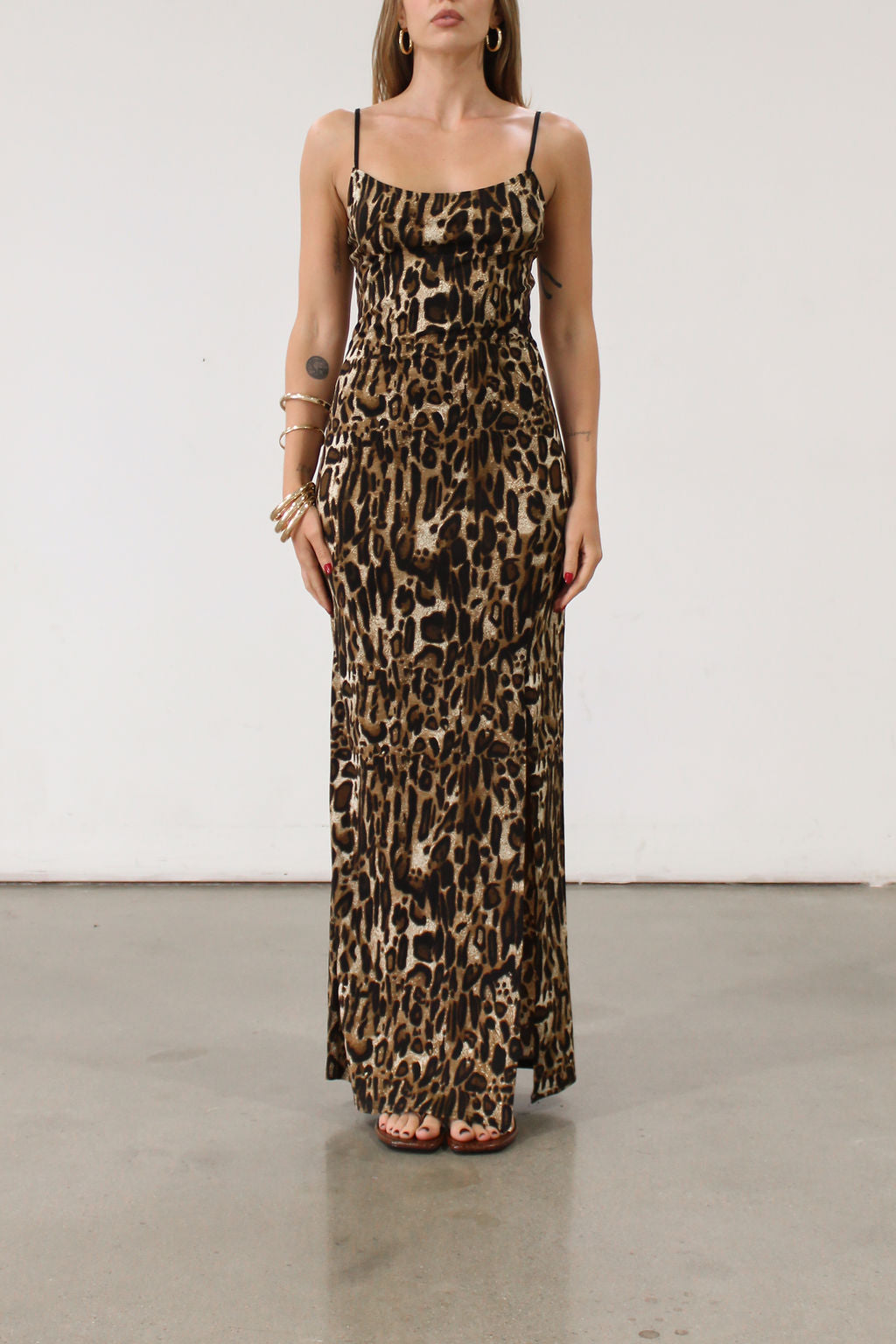 Animal printed knit maxi dress. Adjustable straps. Side slits. Unlined.