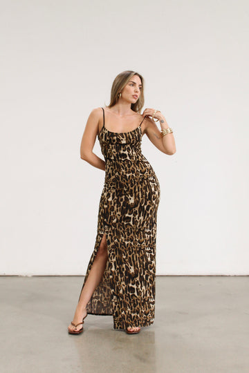 Animal printed knit maxi dress. Adjustable straps. Side slits. Unlined.