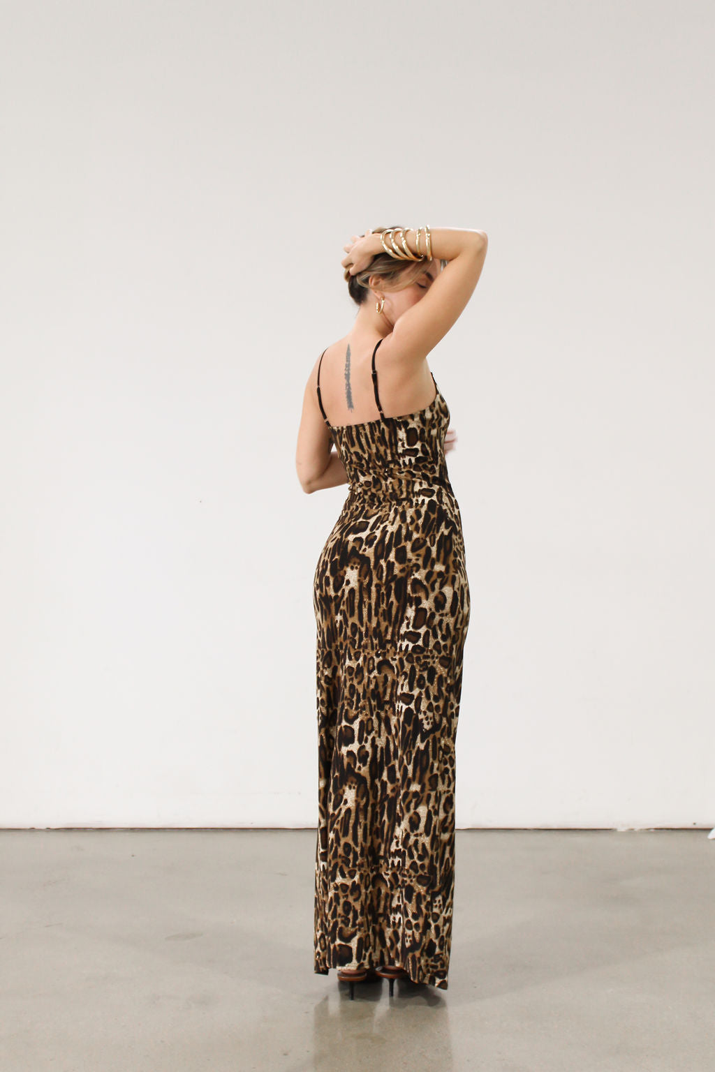 Animal printed knit maxi dress. Adjustable straps. Side slits. Unlined.
