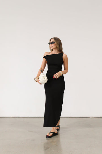 black Ribbed knit maxi dress. Twisted straps. Ruched sides. Unlined.