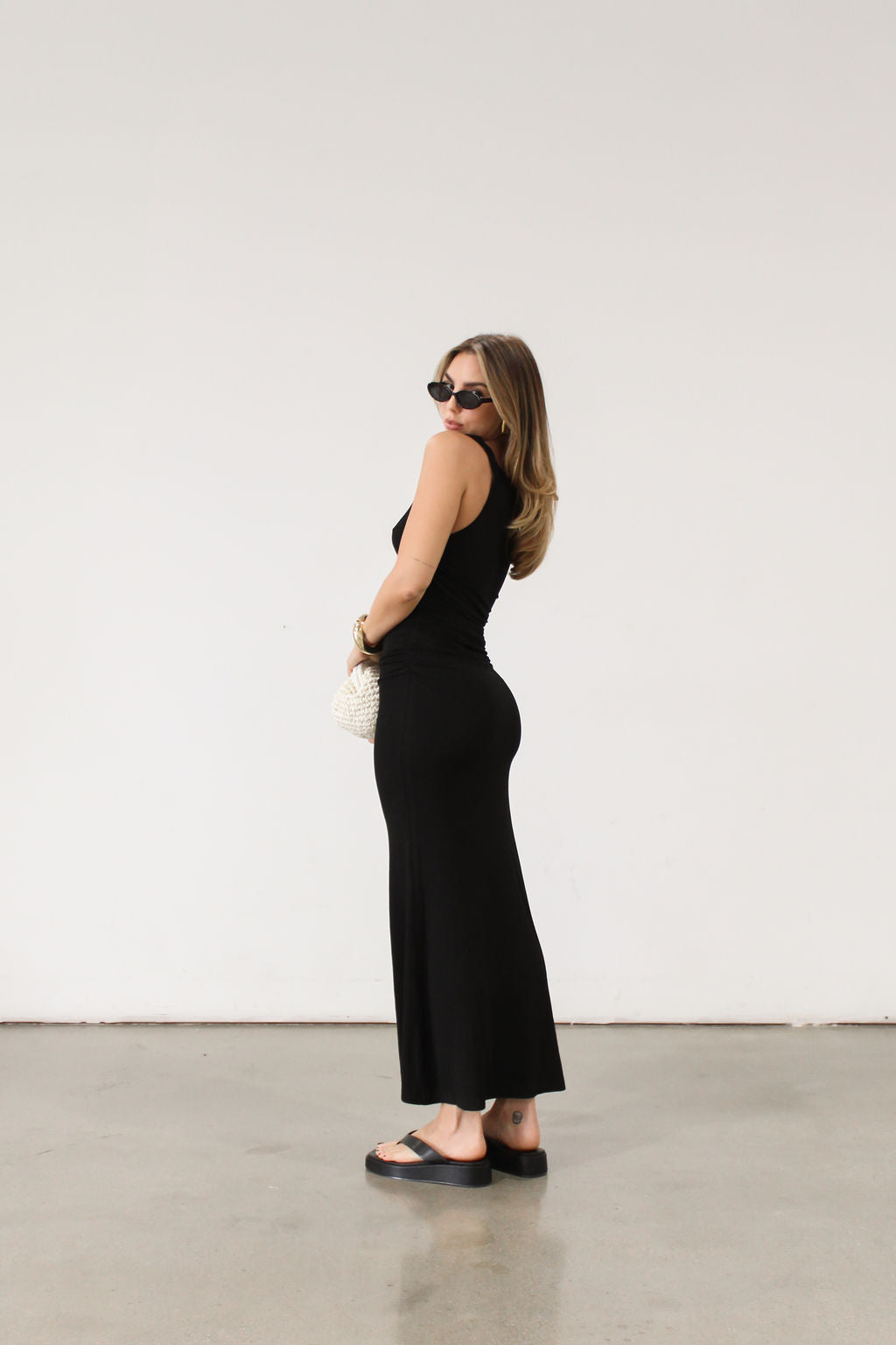black Ribbed knit maxi dress. Twisted straps. Ruched sides. Unlined.