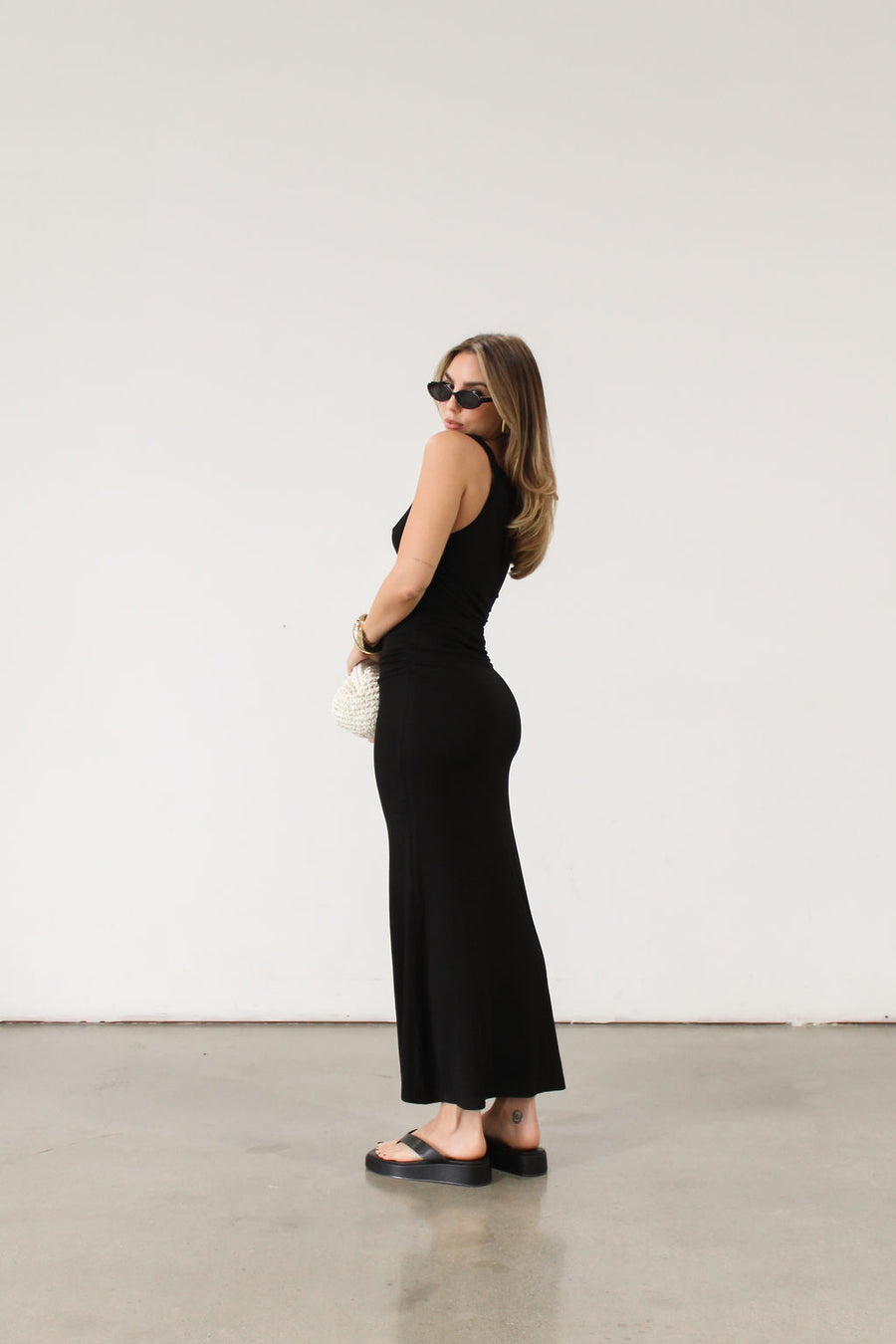black Ribbed knit maxi dress. Twisted straps. Ruched sides. Unlined.