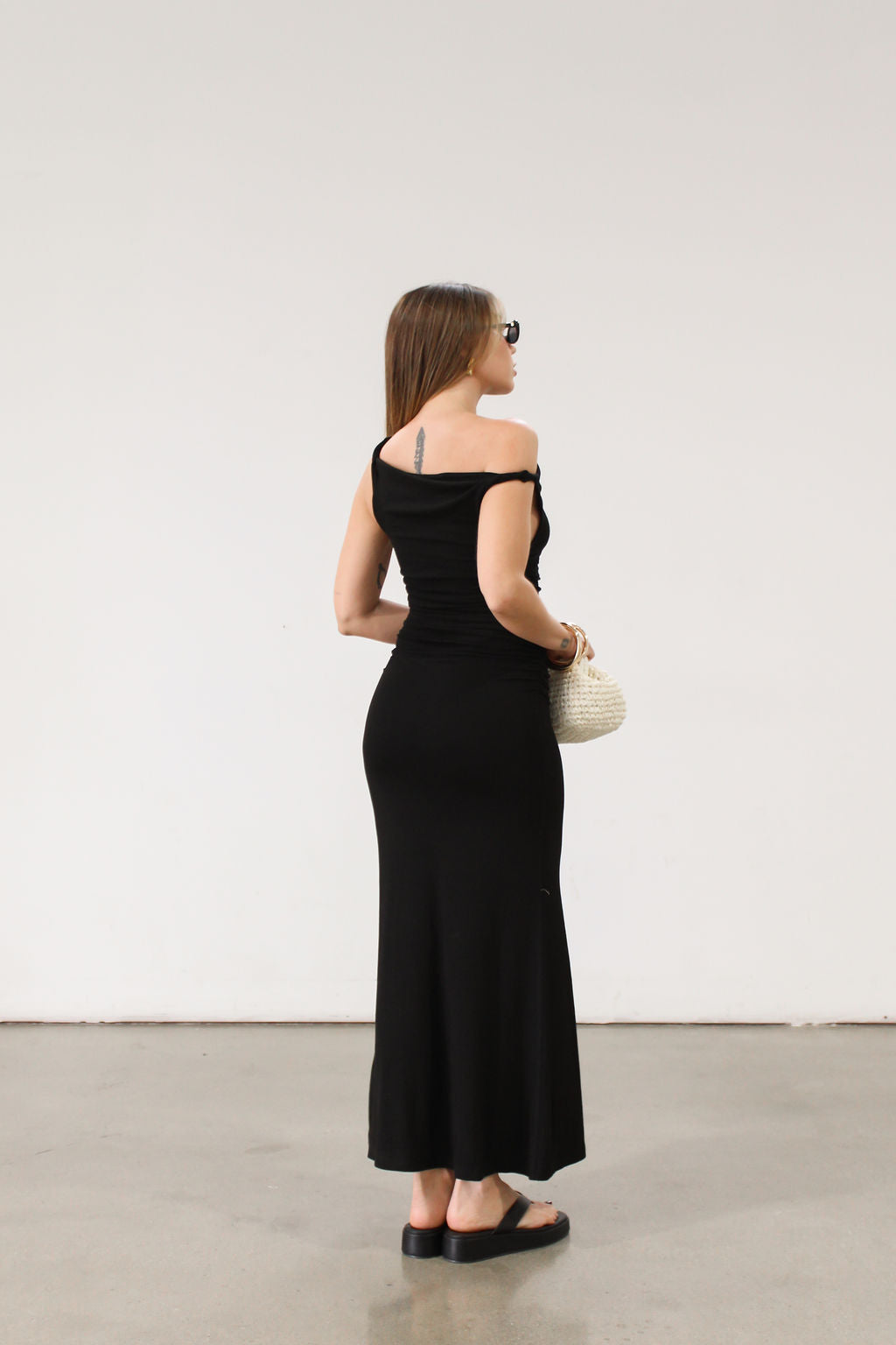 black Ribbed knit maxi dress. Twisted straps. Ruched sides. Unlined.