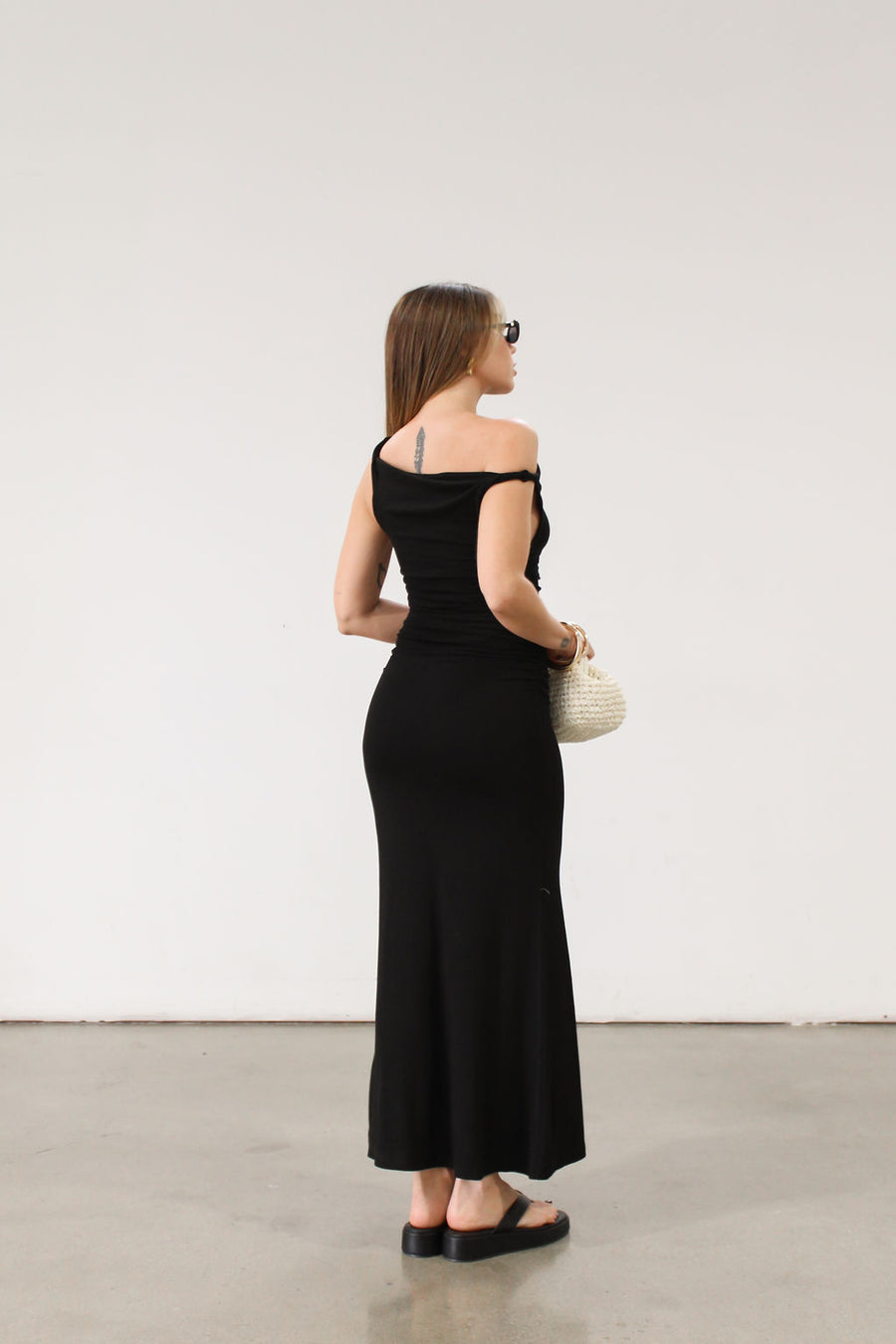 black Ribbed knit maxi dress. Twisted straps. Ruched sides. Unlined.