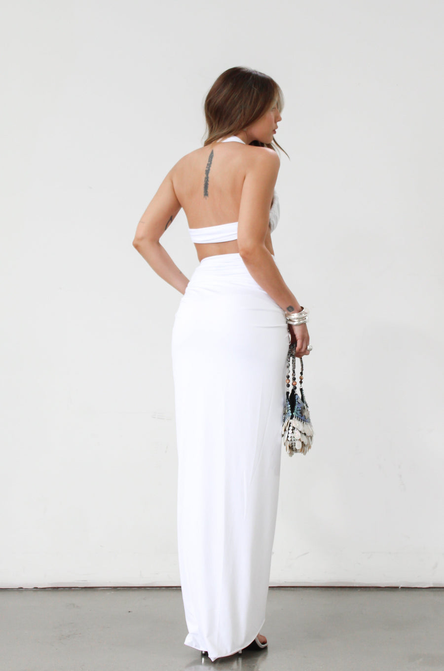 Knit maxi skirt. Knit top. Front keyhole with adjustable tie closure. Front slit. Fully lined. White dress set. White set to wear on vacation. Outfit to wear on vacation. Outfift to wear in Mexico. Mexico outfit. Beach outfit.