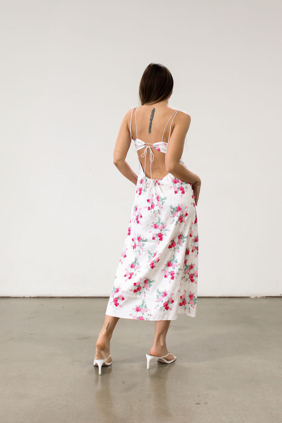 Floral printed satin maxi dress. Adjustable tie straps. Front slot. Adjustable back tie closures. Unlined for love and lemons dress. floral slip dress with lace detail and slit.