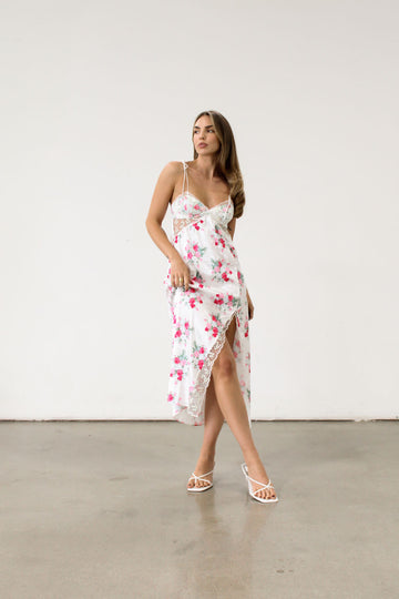 Floral printed satin maxi dress. Adjustable tie straps. Front slot. Adjustable back tie closures. Unlined for love and lemons dress. floral slip dress with lace detail and slit.