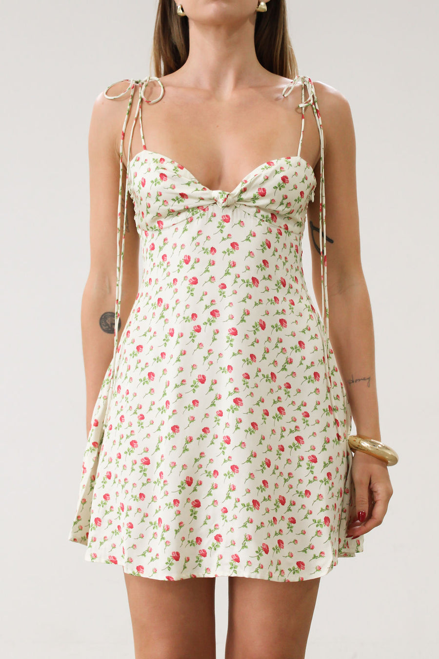 for love and lemons dress. Floral printed satin dress. Adjustable tie straps. Front knot detail. Side hook and eye and zipper closures. Unlined.