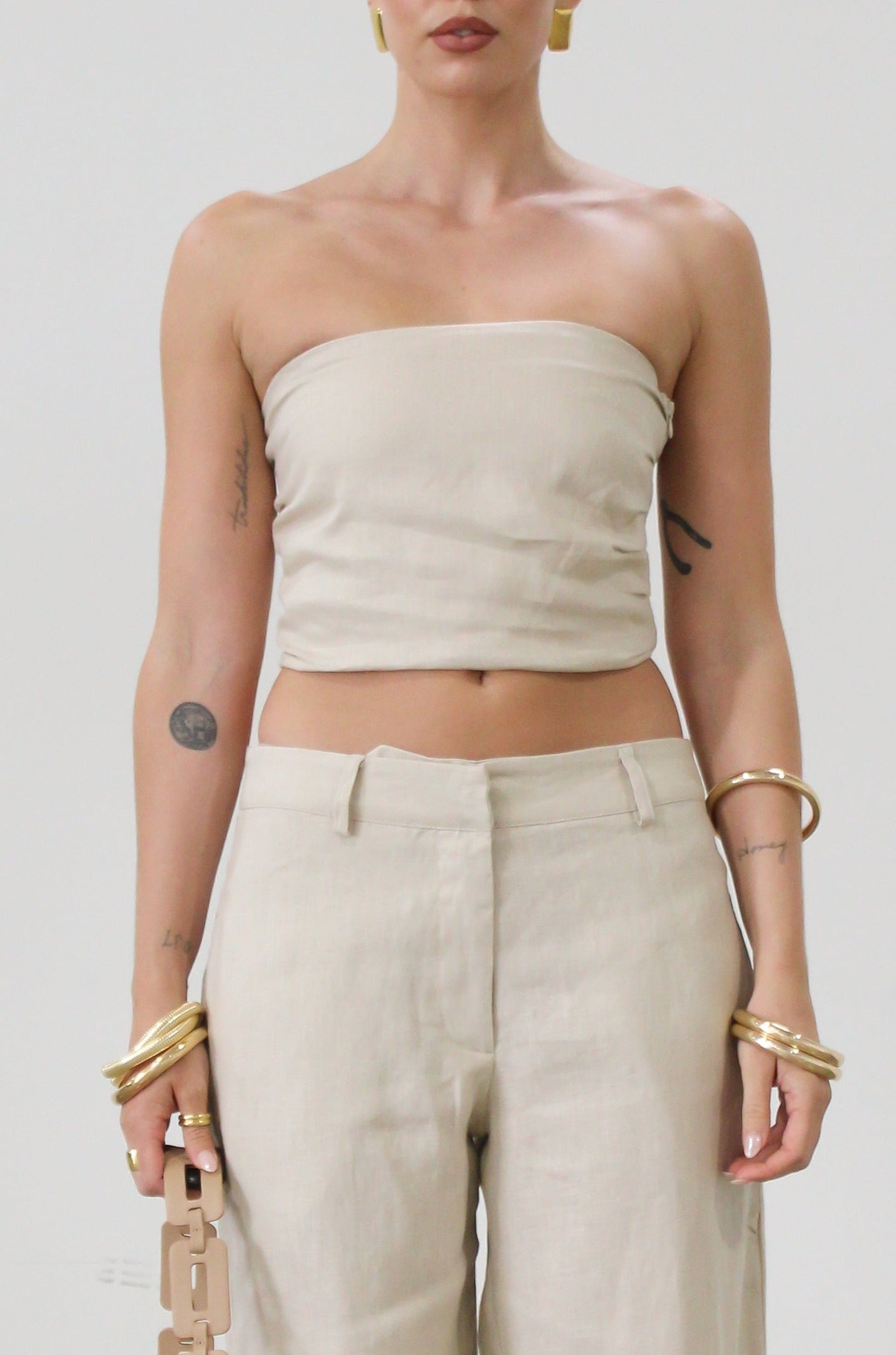 Woven tube top. Elastic smocked back. Fully lined. tan linen tube top. tan linen top. outfit to wear on vacation. minimal tube top. minimal top