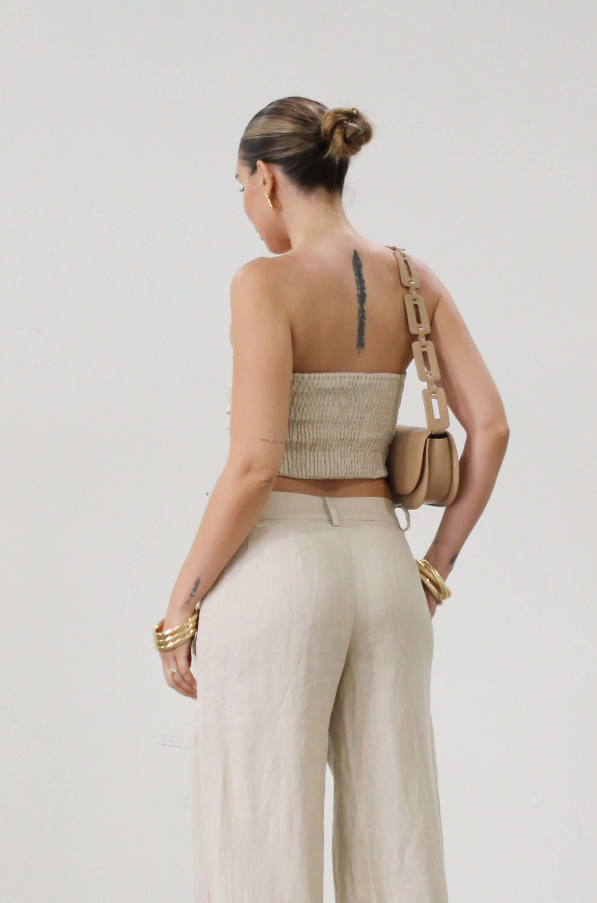 Woven tube top. Elastic smocked back. Fully lined. tan linen tube top. tan linen top. outfit to wear on vacation. minimal tube top. minimal top