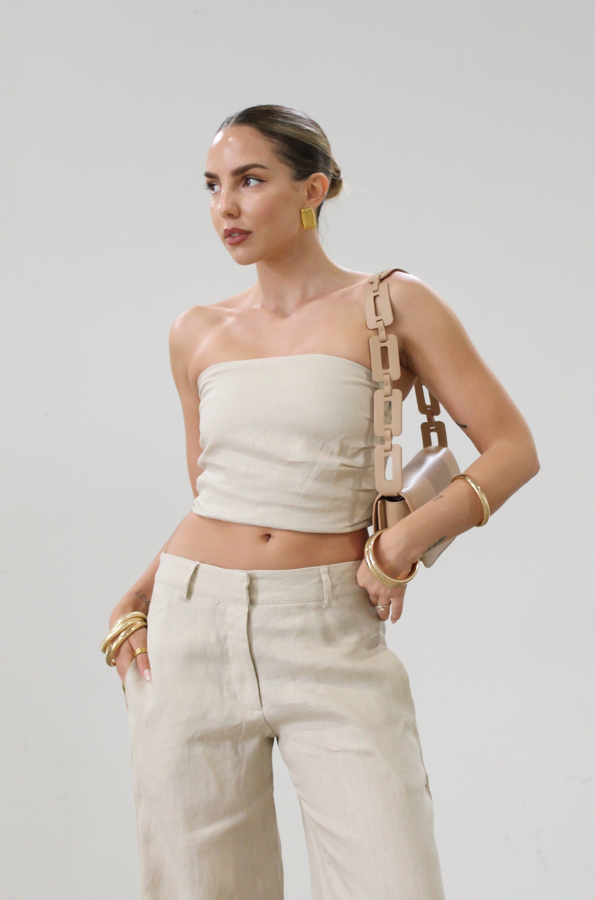 Woven tube top. Elastic smocked back. Fully lined. tan linen tube top. tan linen top. outfit to wear on vacation. minimal tube top. minimal top