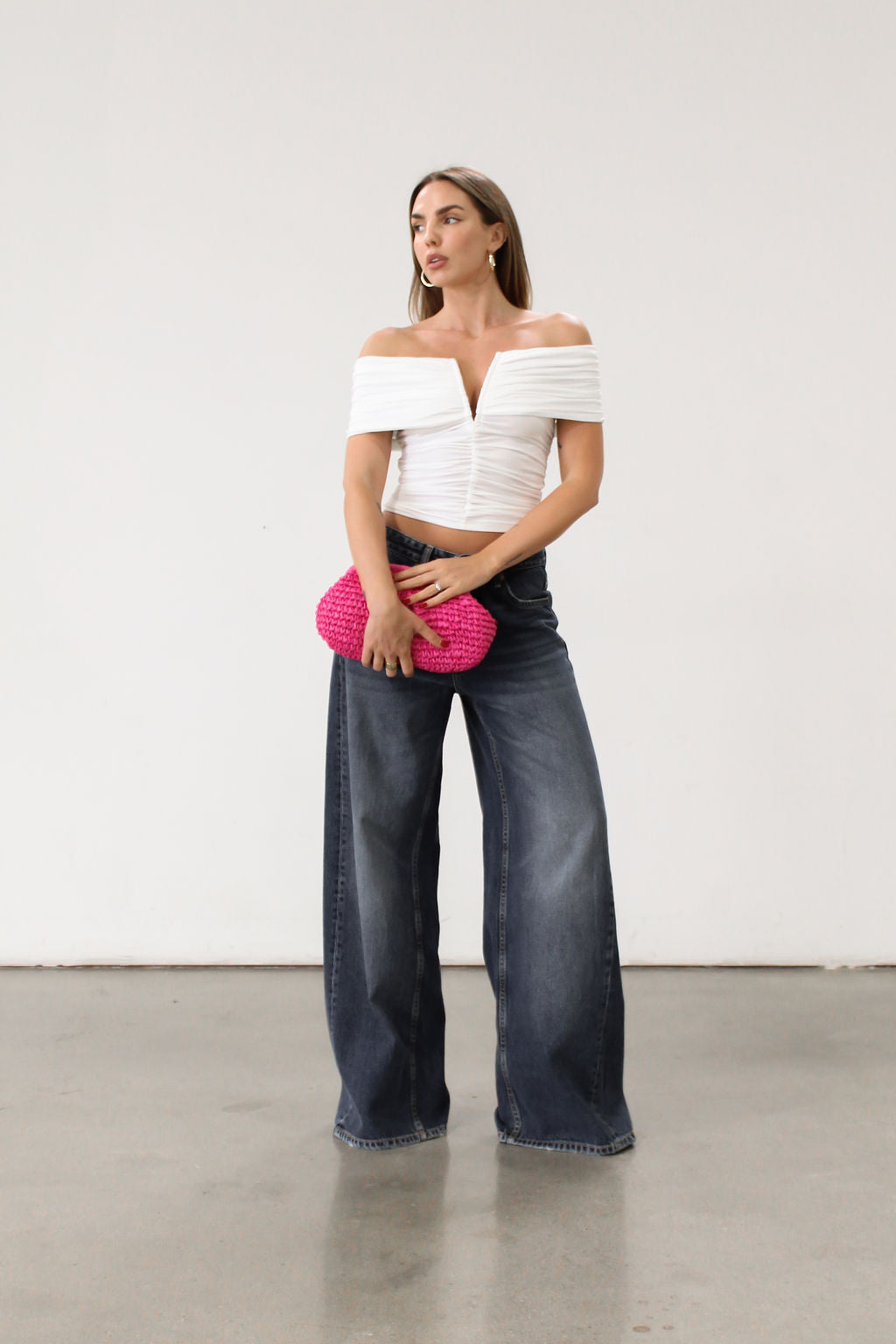 Knit Tube top. Strapless neckline. Front wire. Ruched bodice. Back cut out. Partially lined
