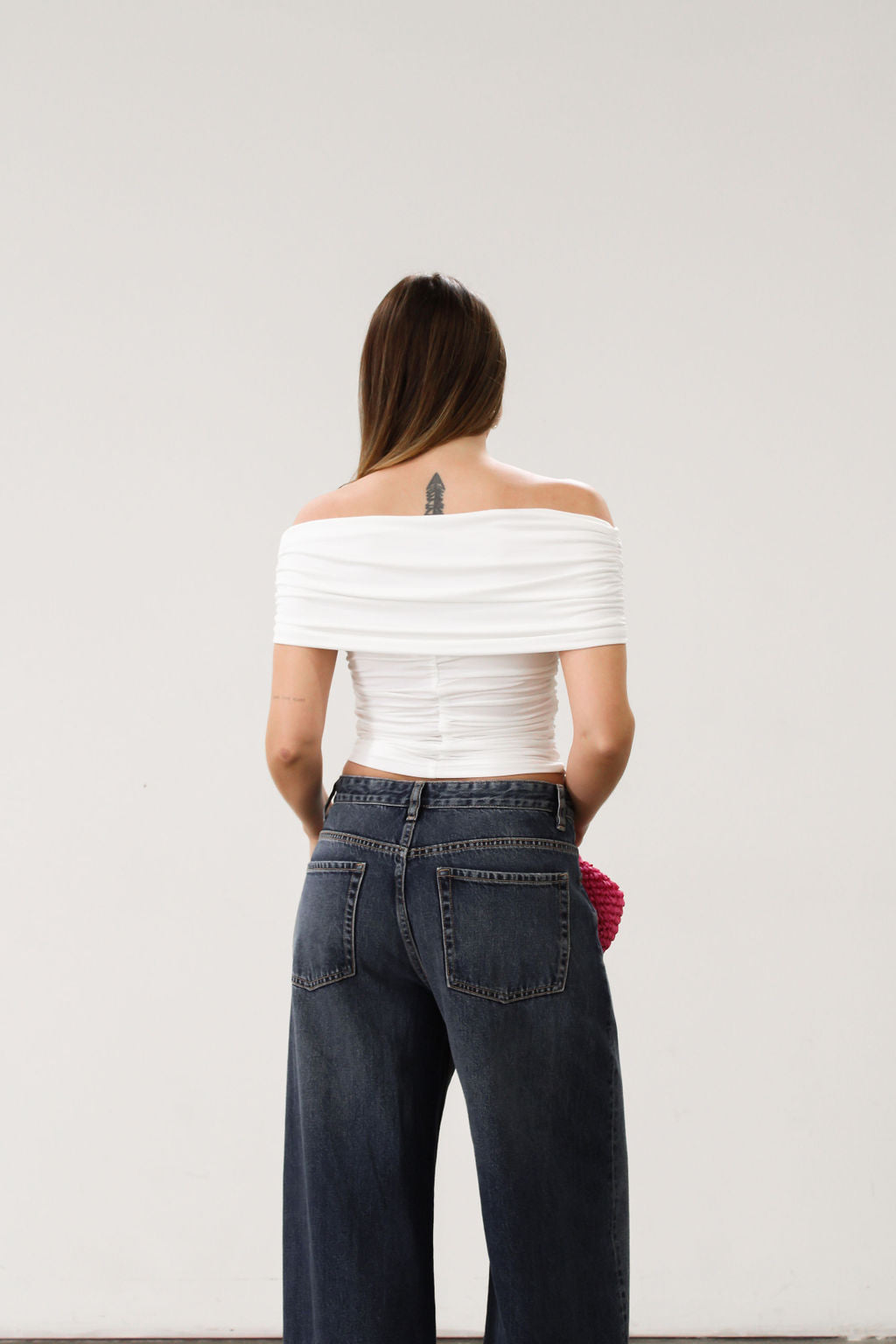 Knit Tube top. Strapless neckline. Front wire. Ruched bodice. Back cut out. Partially lined