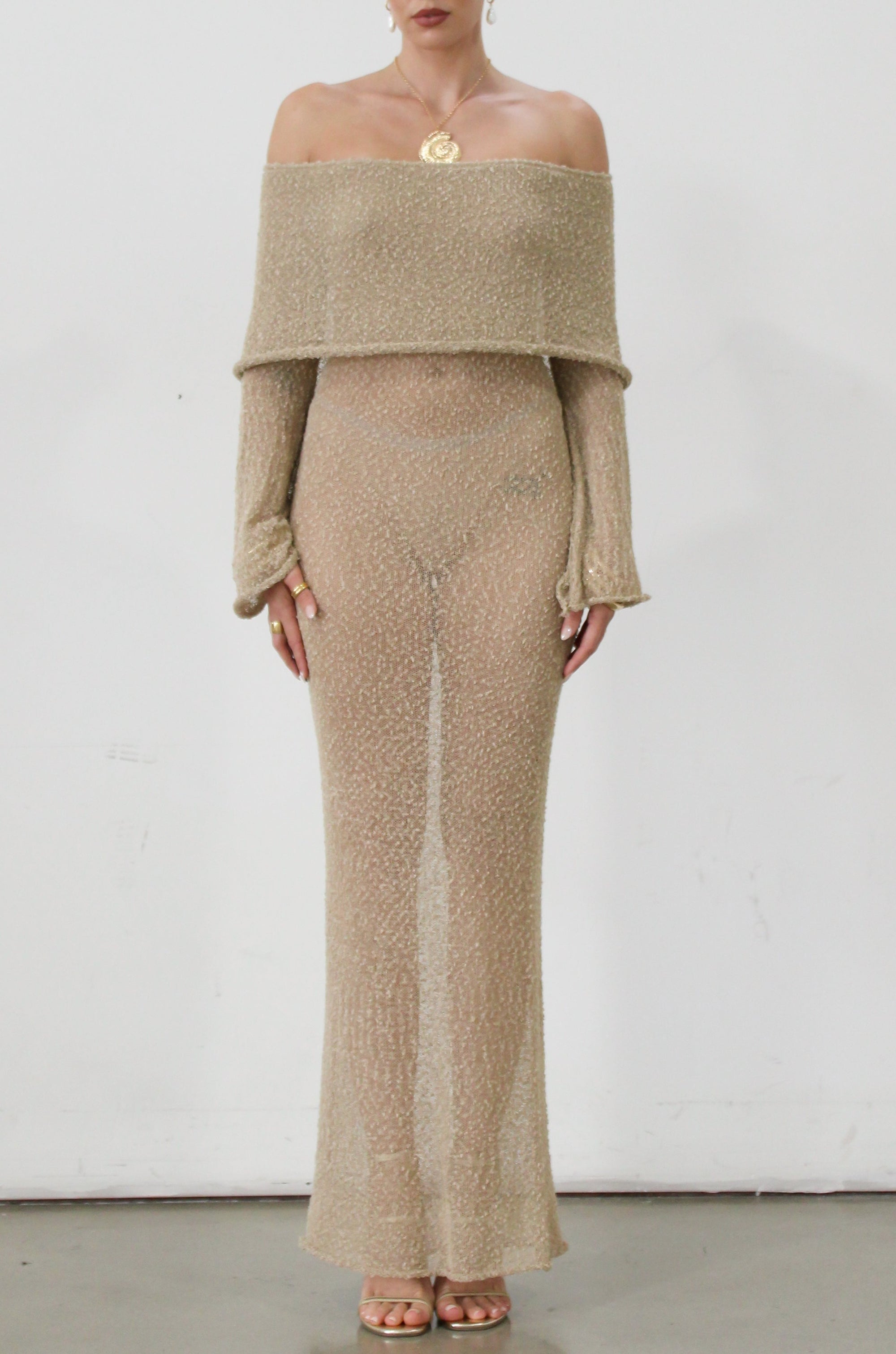 Textured open knit maxi dress. Elastic neckline. Off the shoulder long sleeves. Unlined. beach vacation dress. dress to wear to mexico. dress to wear to miami. beach vacation dress. tan knit dress. tan off the shoulder dress