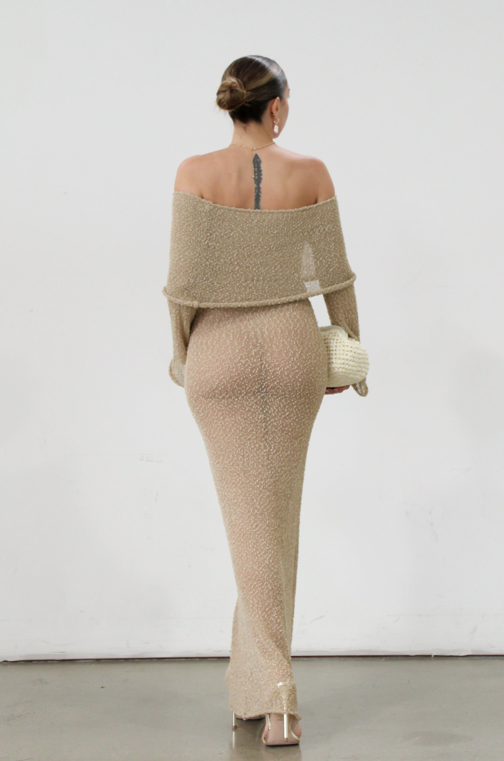 Textured open knit maxi dress. Elastic neckline. Off the shoulder long sleeves. Unlined. beach vacation dress. dress to wear to mexico. dress to wear to miami. beach vacation dress. tan knit dress. tan off the shoulder dress
