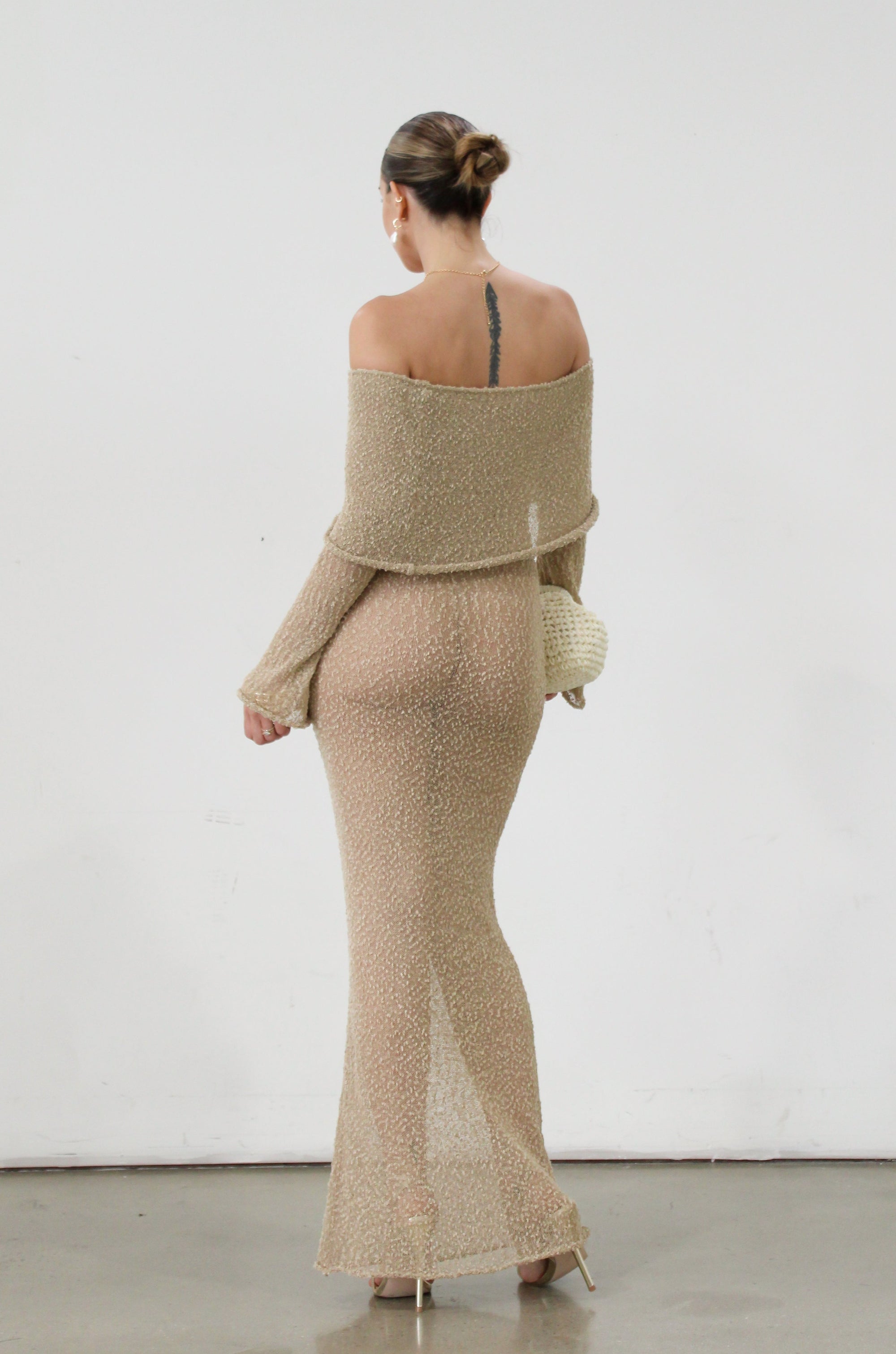Textured open knit maxi dress. Elastic neckline. Off the shoulder long sleeves. Unlined. beach vacation dress. dress to wear to mexico. dress to wear to miami. beach vacation dress. tan knit dress. tan off the shoulder dress