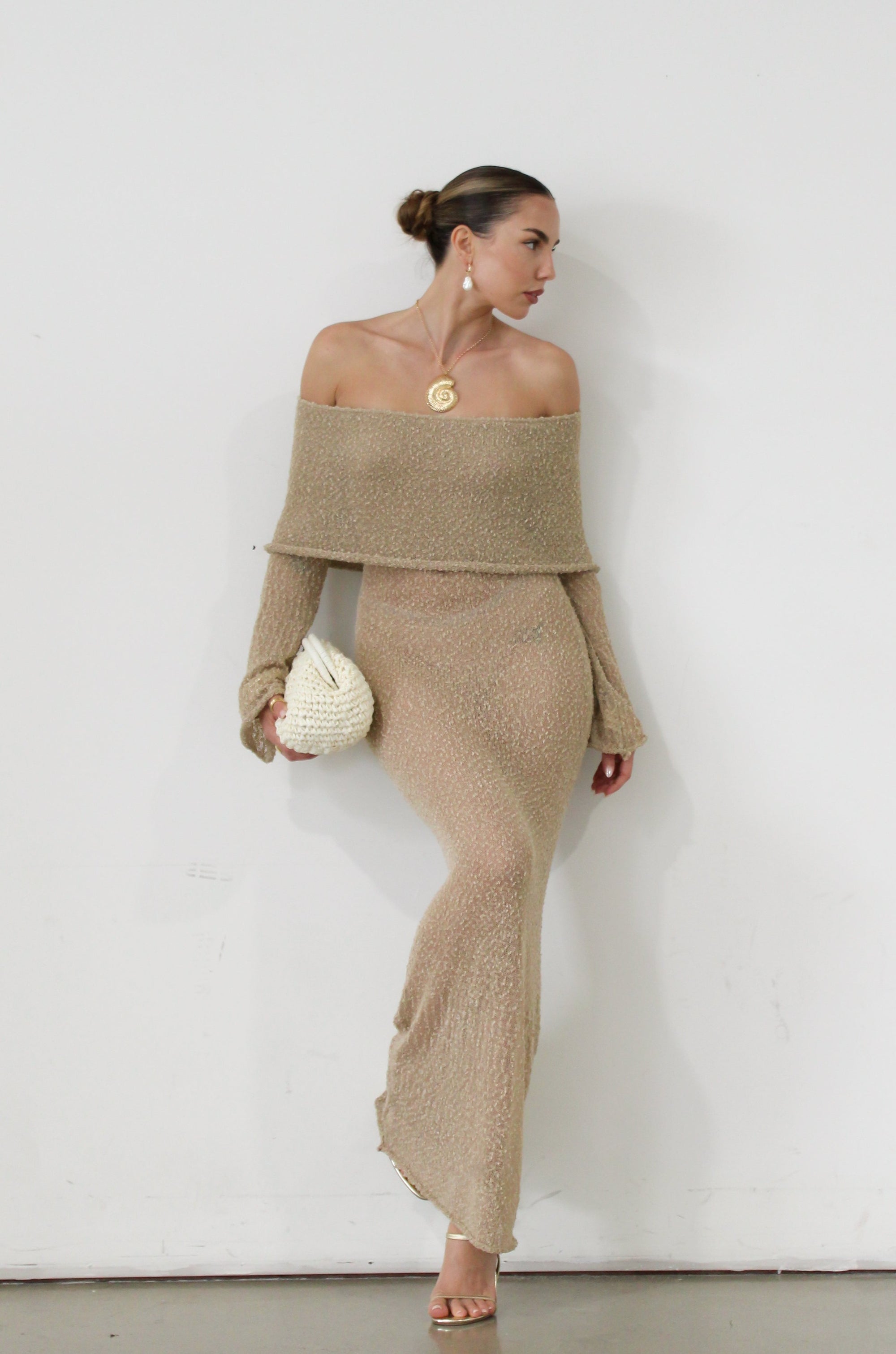 Textured open knit maxi dress. Elastic neckline. Off the shoulder long sleeves. Unlined. beach vacation dress. dress to wear to mexico. dress to wear to miami. beach vacation dress. tan knit dress. tan off the shoulder dress