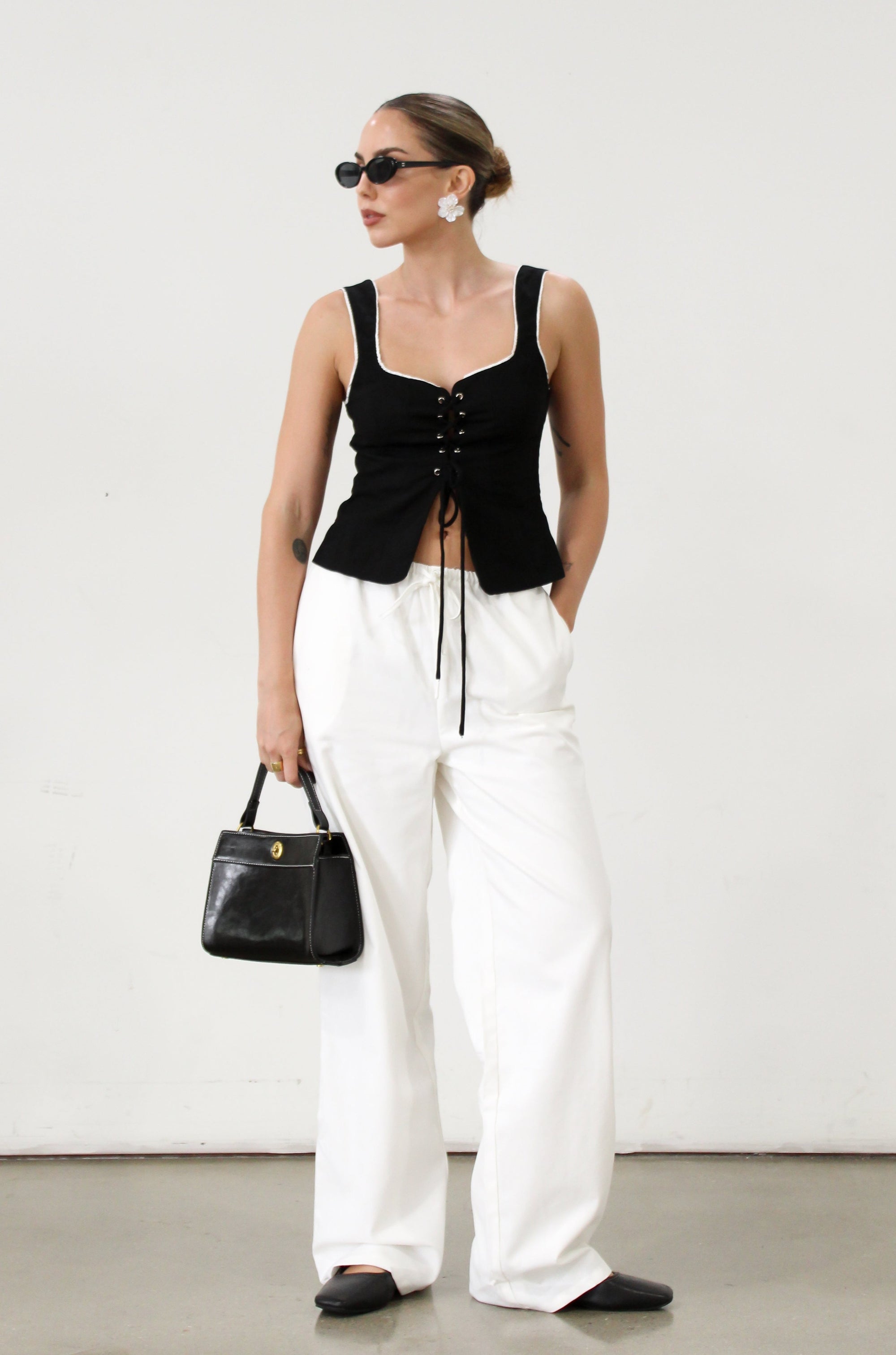 Woven crop top. Fixed straps. Front lace up closure. Side hook and eye and zipper closures. Fully line. black tank top. black top with white outline. summer top. top for summer. going out top. european summer aesthetic