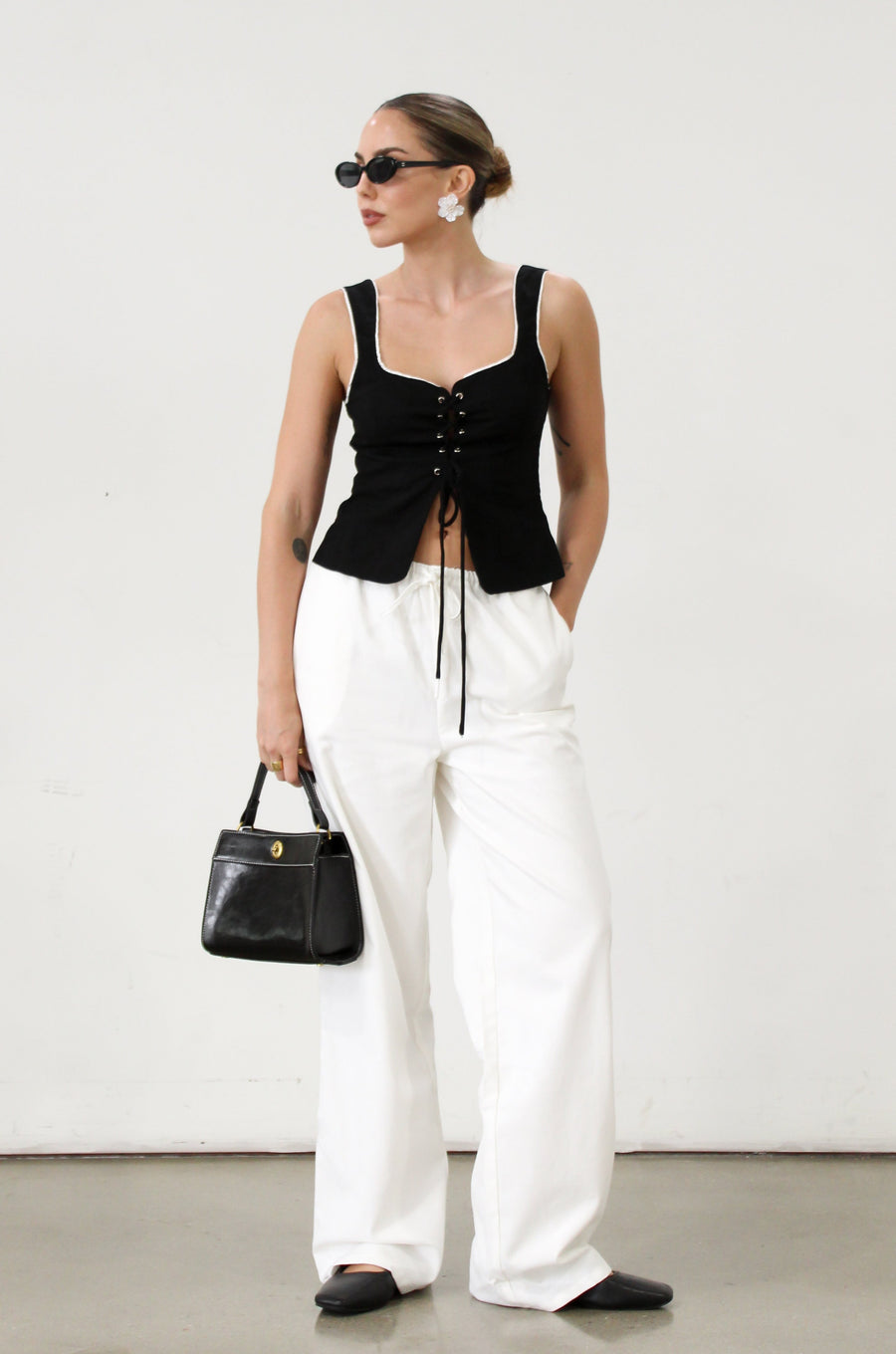Woven crop top. Fixed straps. Front lace up closure. Side hook and eye and zipper closures. Fully line. black tank top. black top with white outline. summer top. top for summer. going out top. european summer aesthetic