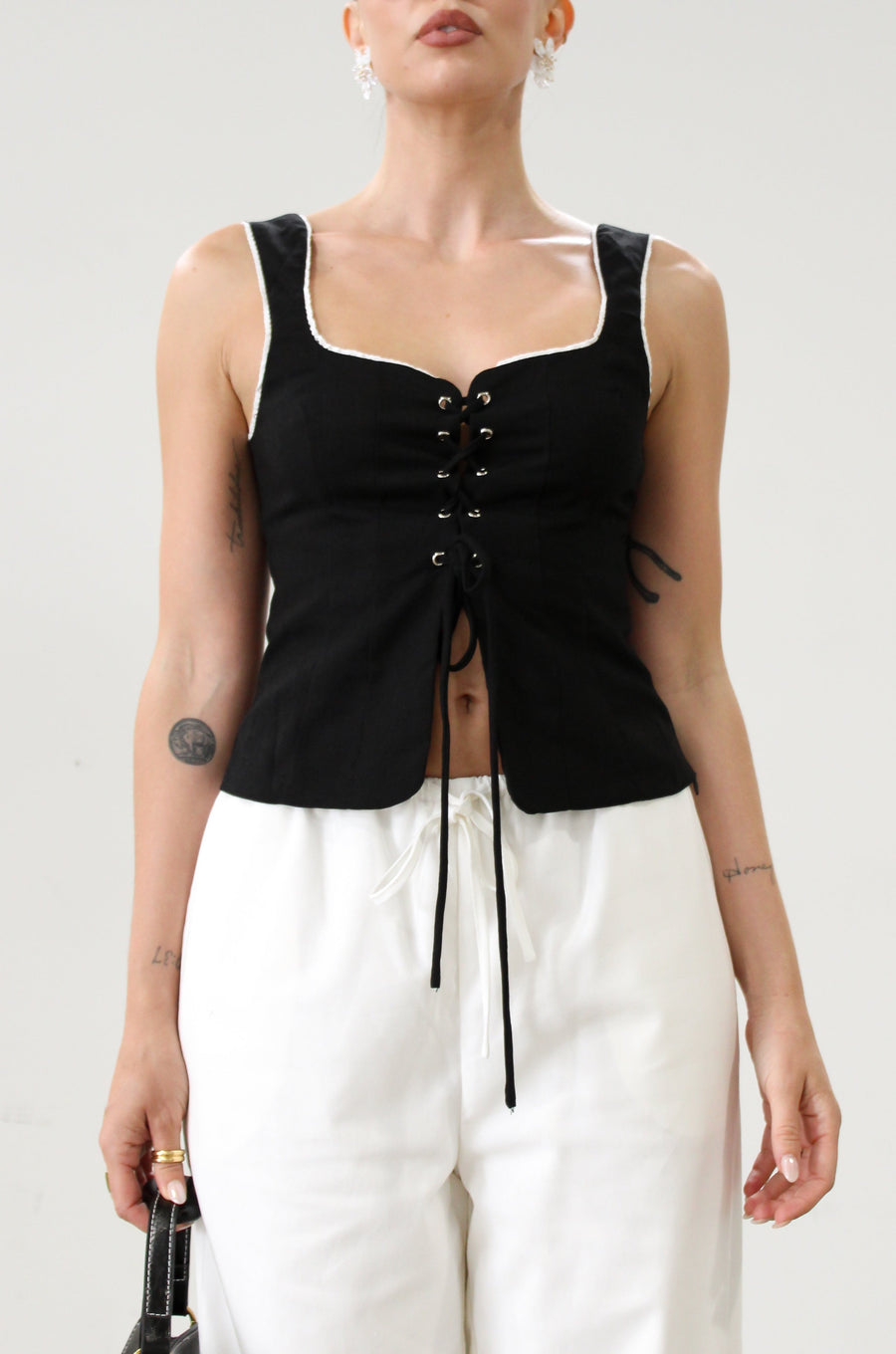 Woven crop top. Fixed straps. Front lace up closure. Side hook and eye and zipper closures. Fully line. black tank top. black top with white outline. summer top. top for summer. going out top. european summer aesthetic