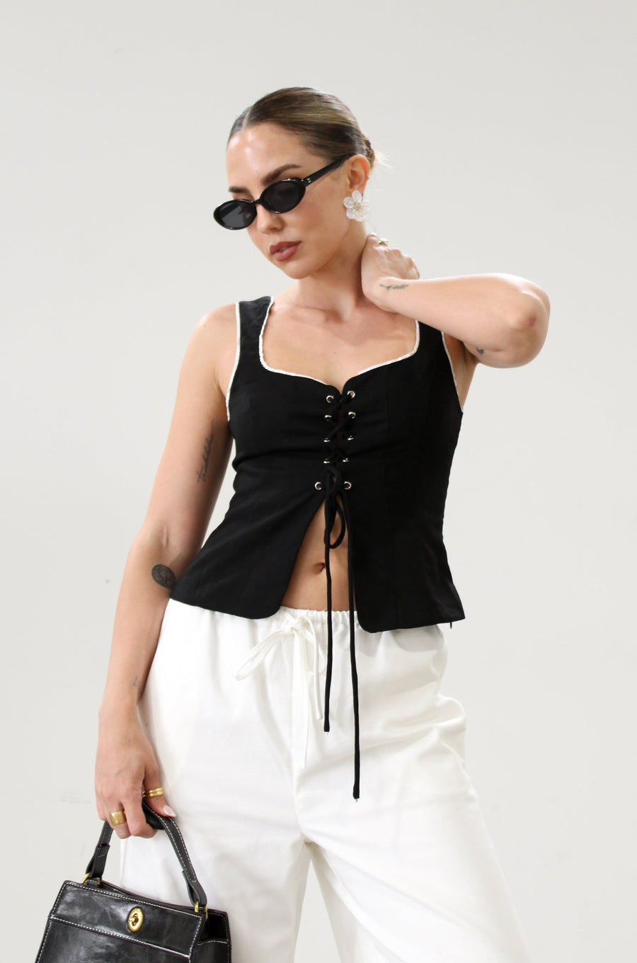 Woven crop top. Fixed straps. Front lace up closure. Side hook and eye and zipper closures. Fully line. black tank top. black top with white outline. summer top. top for summer. going out top. european summer aesthetic