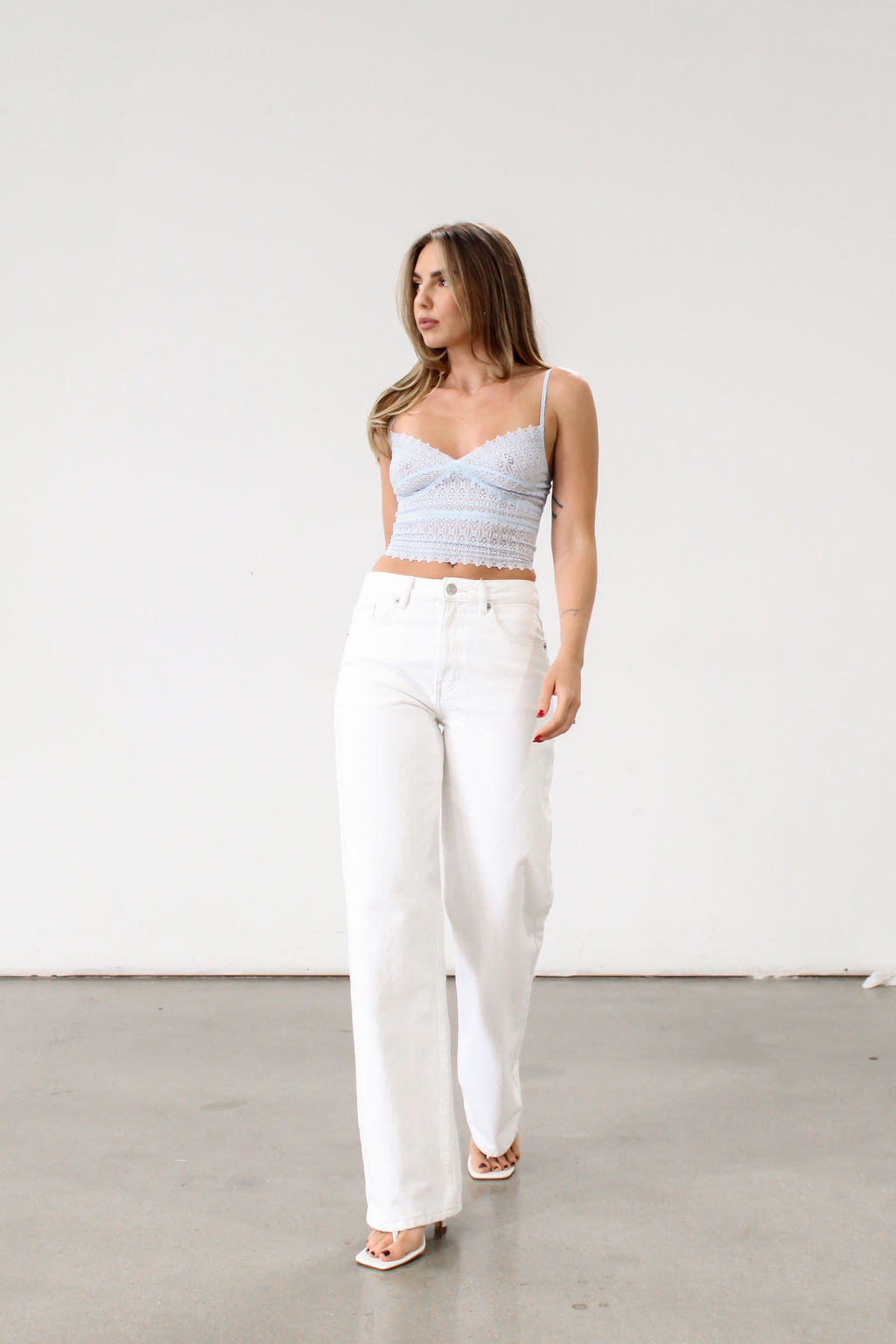 Knit lace cropped tank top. Elastic straps. Elastic back neckline. Ribbed knit back panel. Unlined. Baby blue lace tank top.