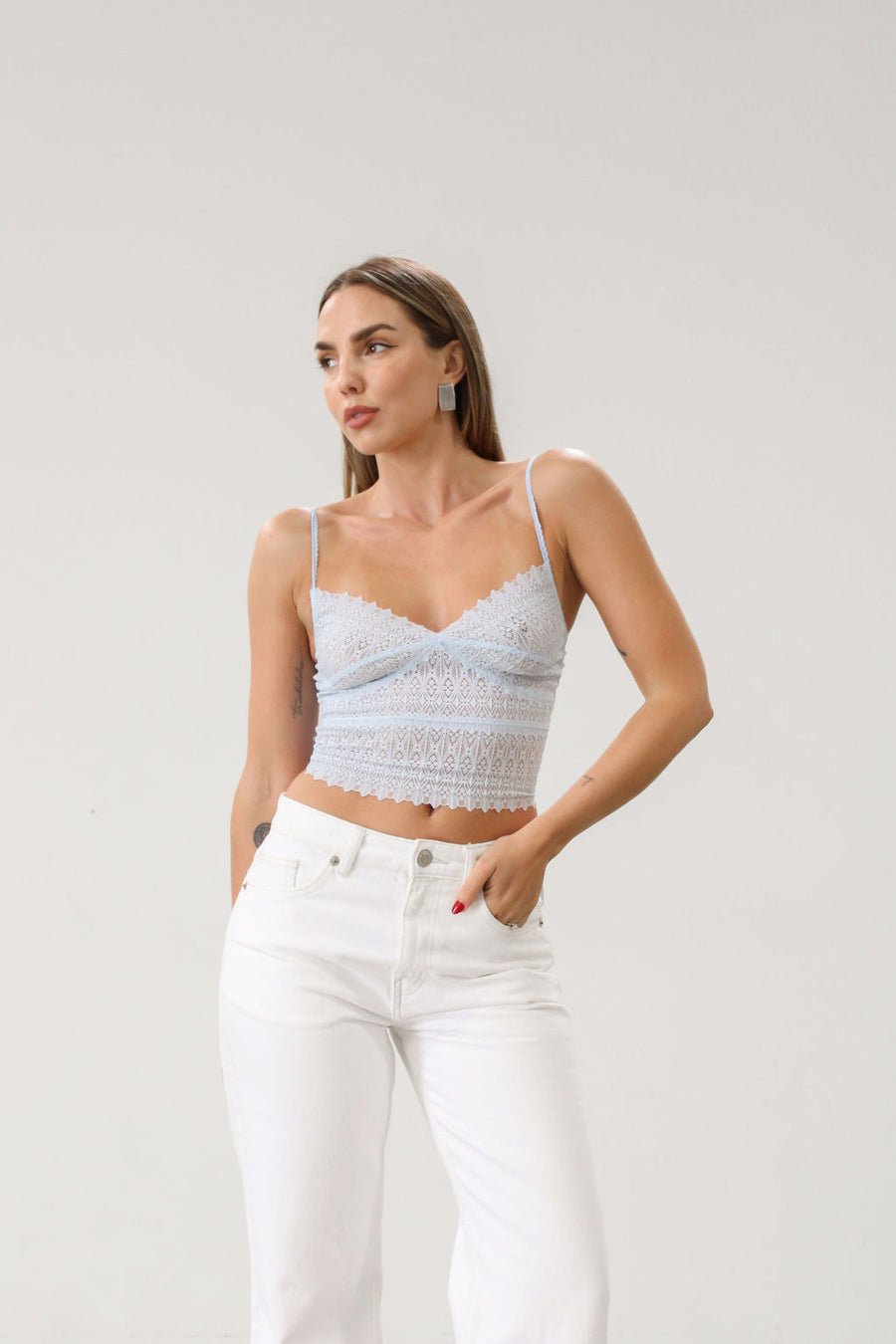 Knit lace cropped tank top. Elastic straps. Elastic back neckline. Ribbed knit back panel. Unlined. Baby blue lace tank top.