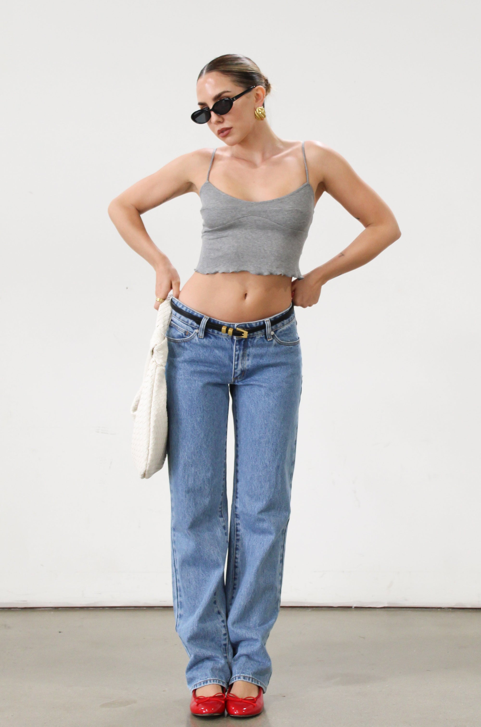 Ribbed knit cropped tank top. Adjustable straps. Lettuce edge hem. Unlined. basic crop top. basic tank top. basic grey tank top. grey tank top. grey crop tank top. everyday tank top