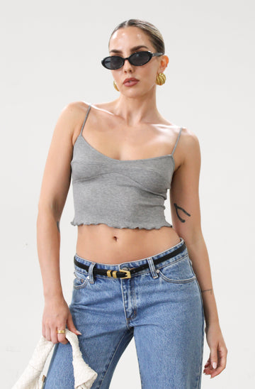 Ribbed knit cropped tank top. Adjustable straps. Lettuce edge hem. Unlined. basic crop top. basic tank top. basic grey tank top. grey tank top. grey crop tank top. everyday tank top