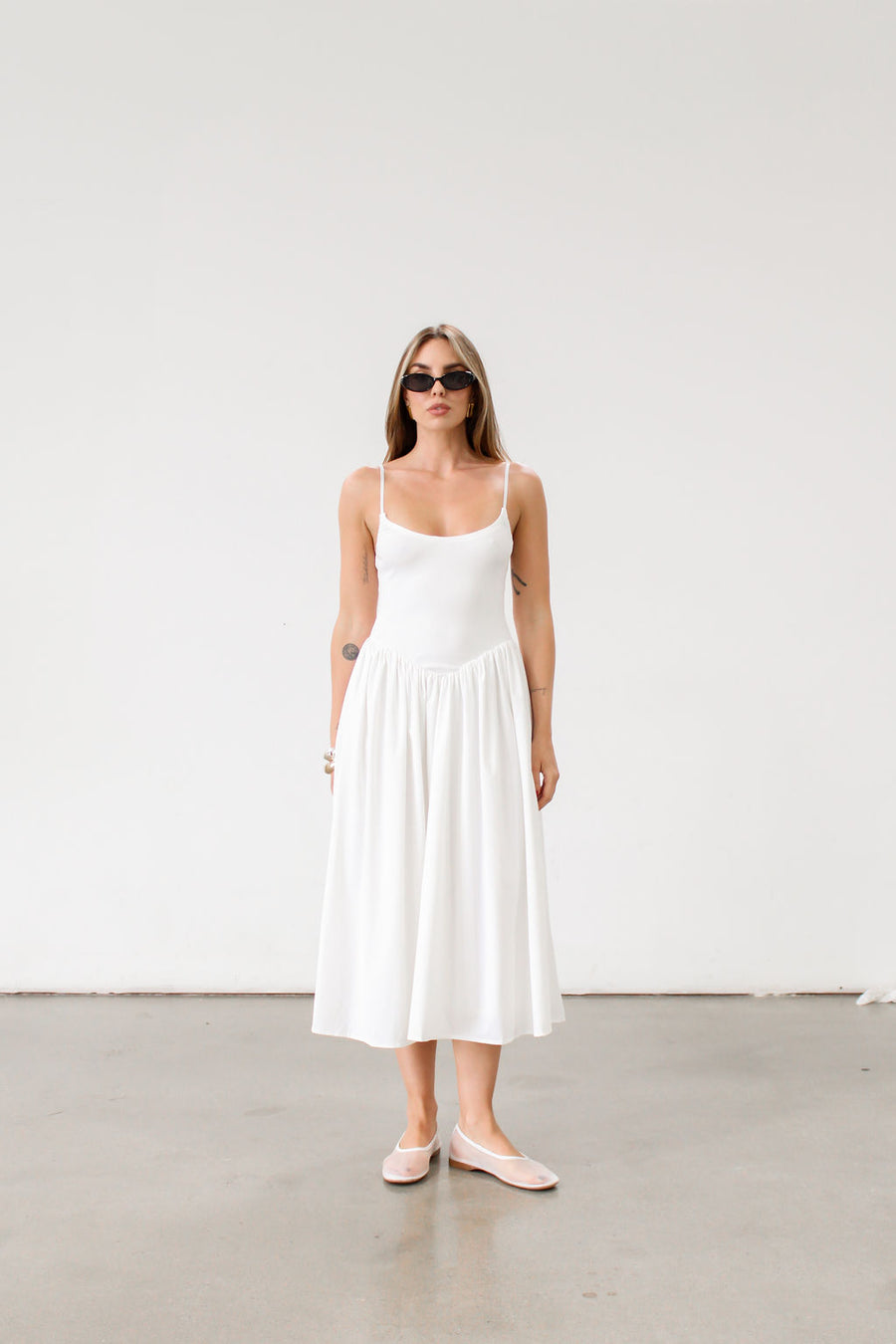 Knit midi dress. Ribbed knit bodice. Adjustable straps. Partially lined.  