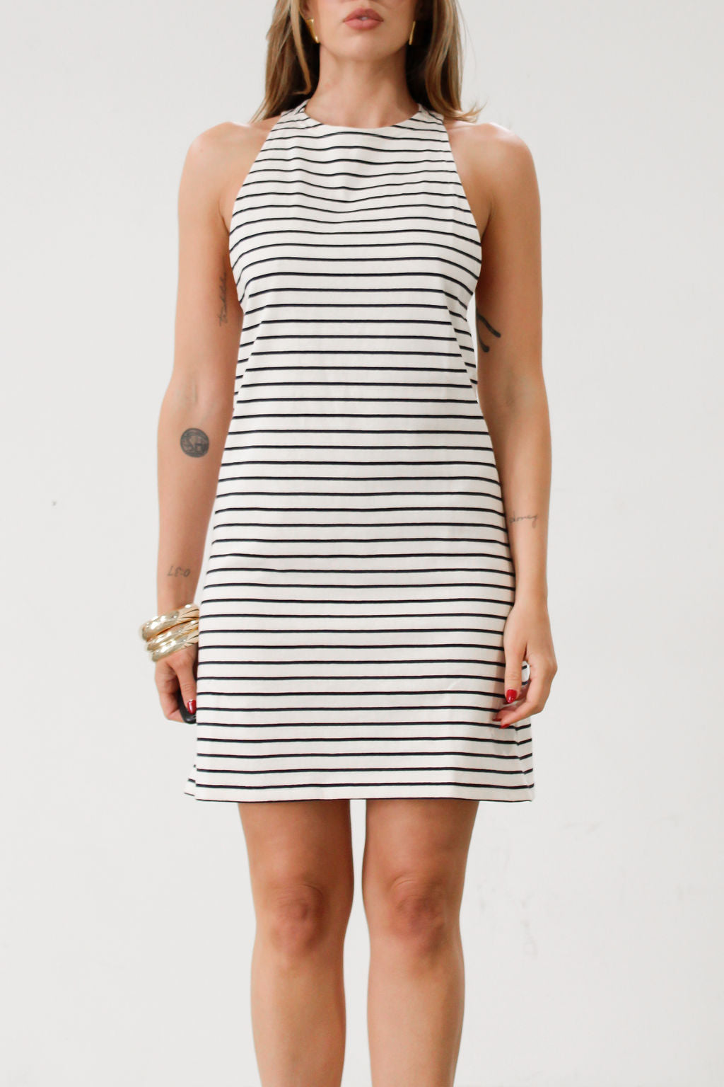 Striped knit dress. Sleeveless. Racerback. Unlined. Black and white stripes