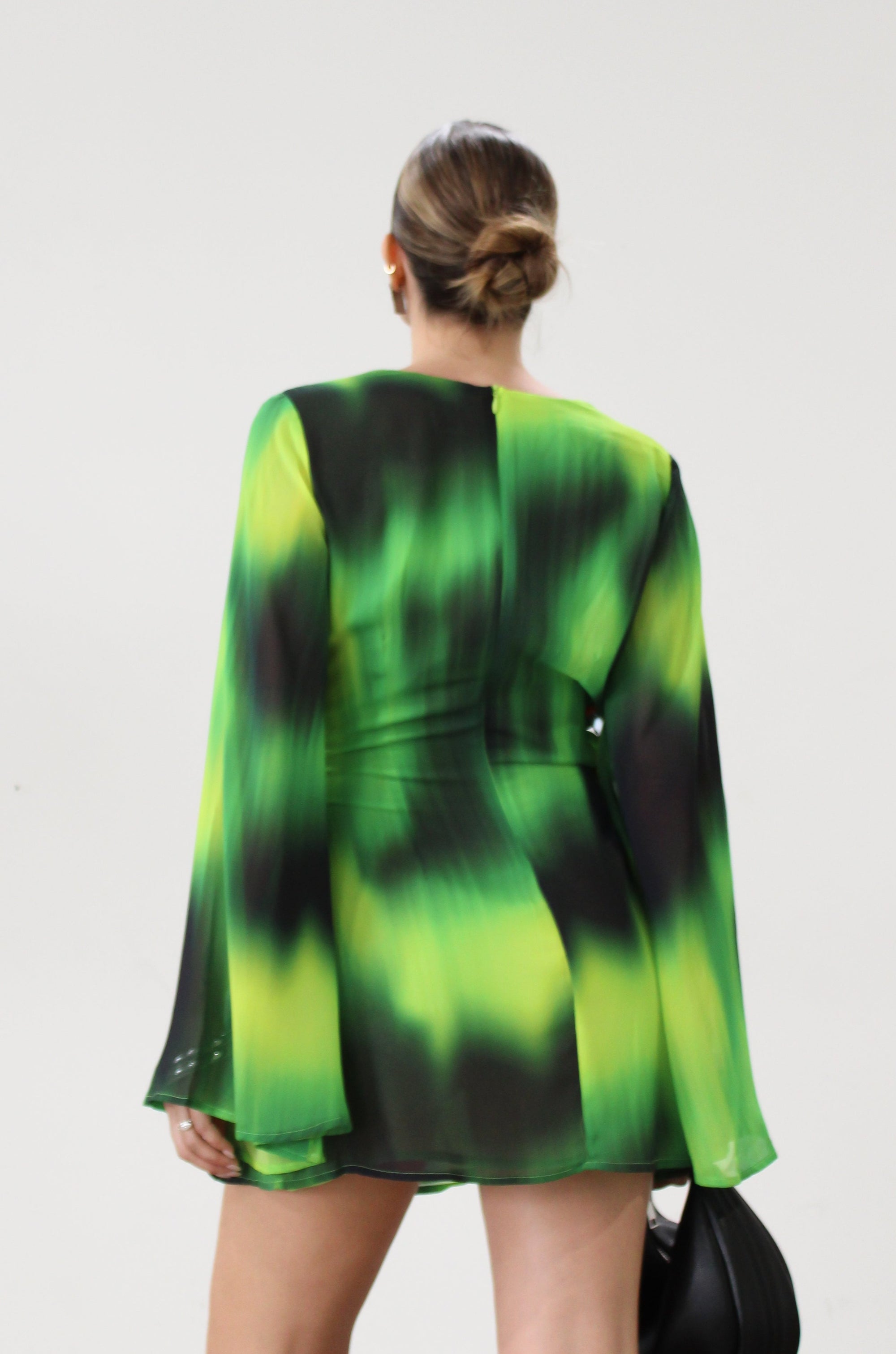 Chiffon dress. Long bell sleeves. V-neckline with tie closure. Front slit. Back hook and eye and zipper closures. Partially lined. green dress. beach vacation dress. green mini dress. mexico dress. miami dress. going out dress