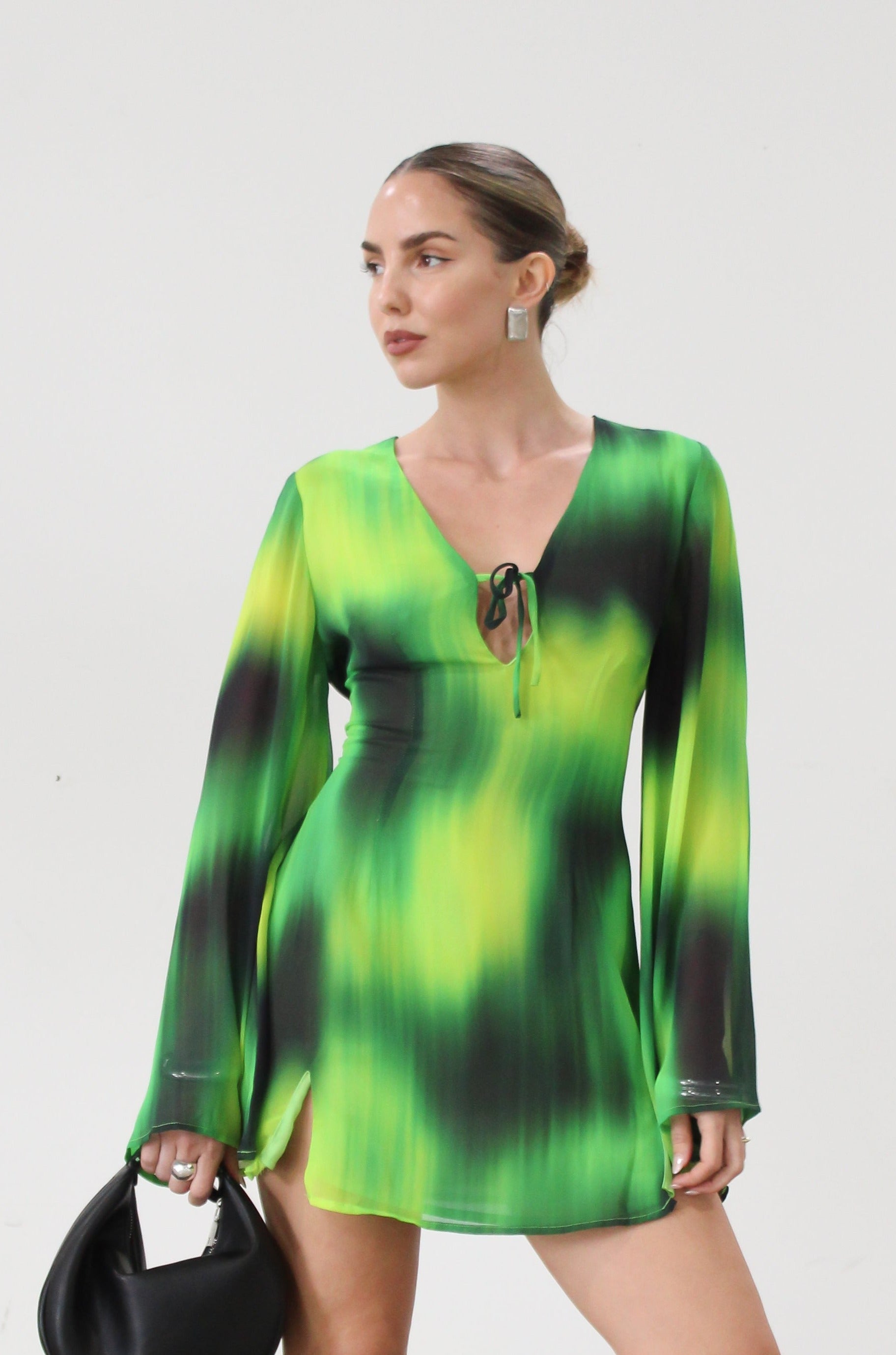 Chiffon dress. Long bell sleeves. V-neckline with tie closure. Front slit. Back hook and eye and zipper closures. Partially lined. green dress. beach vacation dress. green mini dress. mexico dress. miami dress. going out dress
