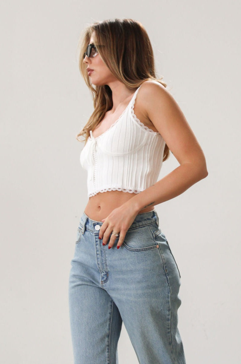 Knit crop tank. Fixed straps. Lace trim. Front tie detail. Back button down closures. Unlined. White tank top. Summer top.