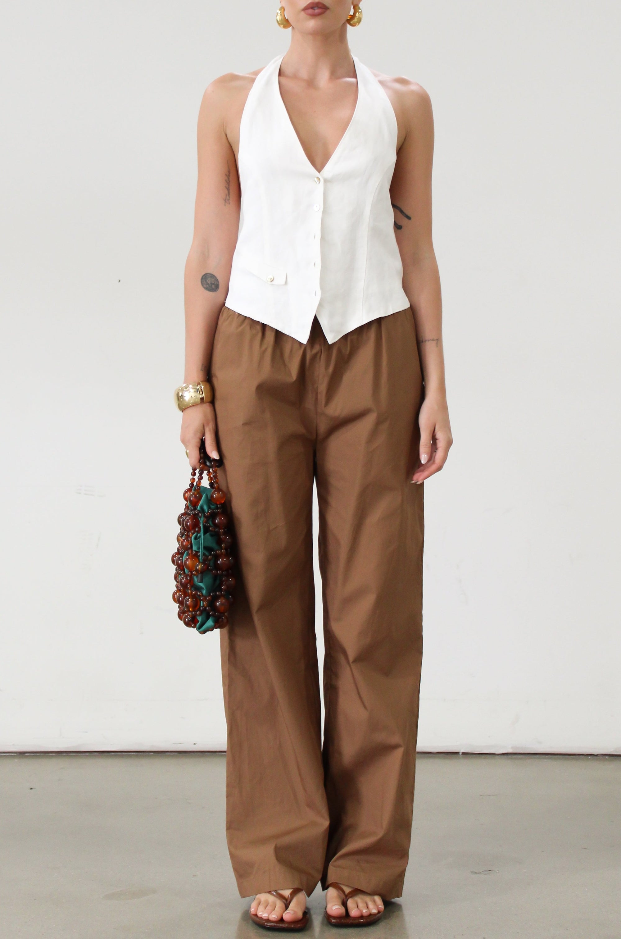 Woven pants. Elastic waistband. Side pockets. Unlined. Brown throw on pants. Cute casual pants. 