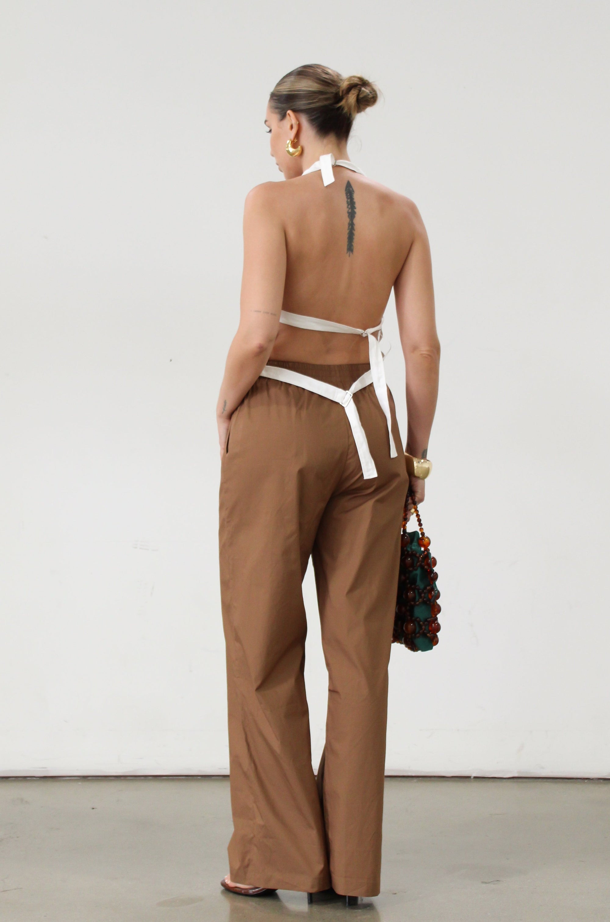 Woven pants. Elastic waistband. Side pockets. Unlined. Brown throw on pants. Cute casual pants. 