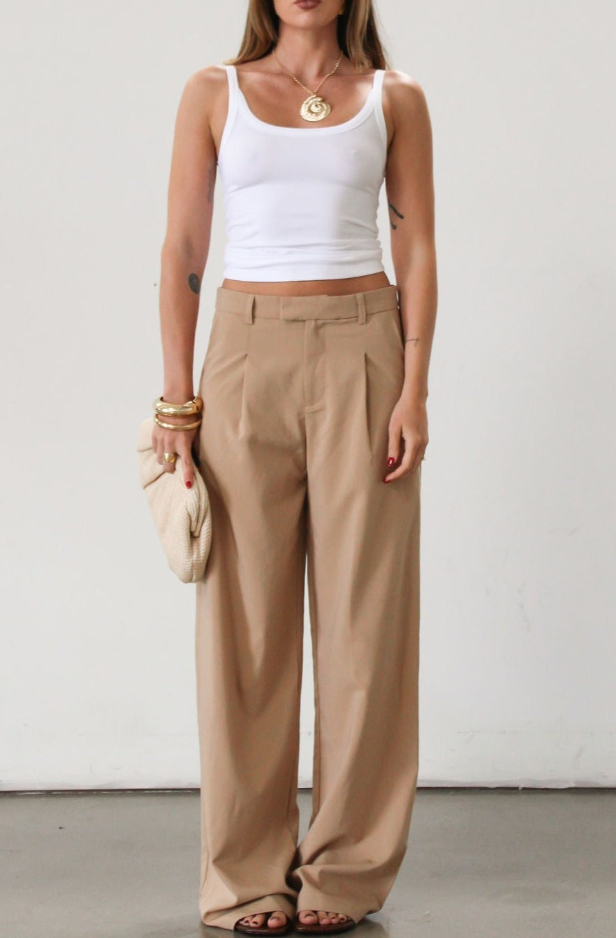 Woven wide leg pant. Hook and eye and zipper fly. Side pockets. Unlined. Tan pants. Office pants. Business casual pants. Business professional pants.