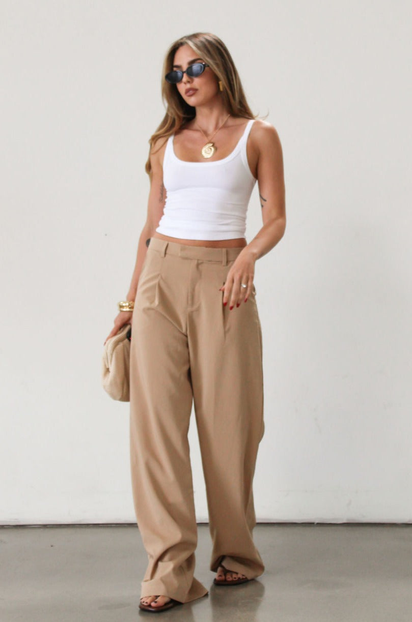 Woven wide leg pant. Hook and eye and zipper fly. Side pockets. Unlined. Tan pants. Office pants. Business casual pants. Business professional pants.