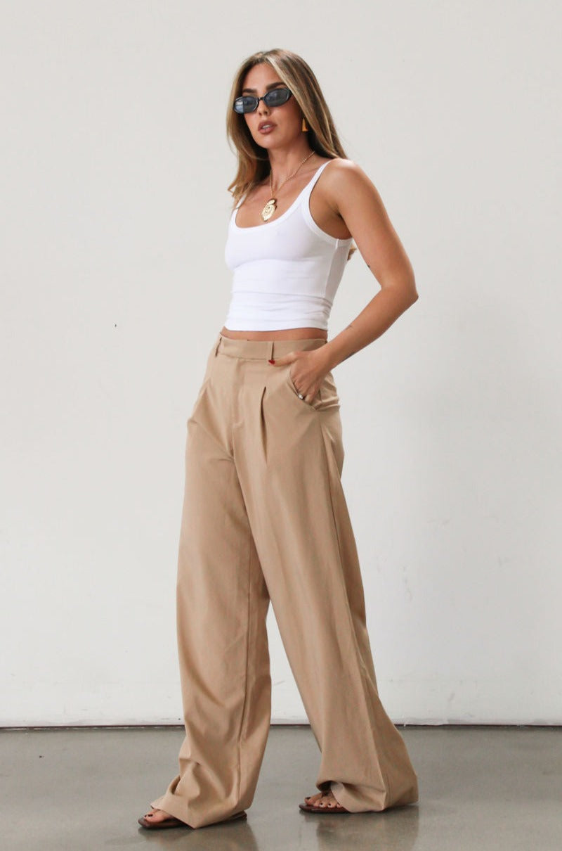 Woven wide leg pant. Hook and eye and zipper fly. Side pockets. Unlined. Tan pants. Office pants. Business casual pants. Business professional pants.