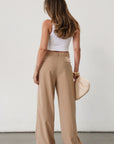 Woven wide leg pant. Hook and eye and zipper fly. Side pockets. Unlined. Tan pants. Office pants. Business casual pants. Business professional pants.