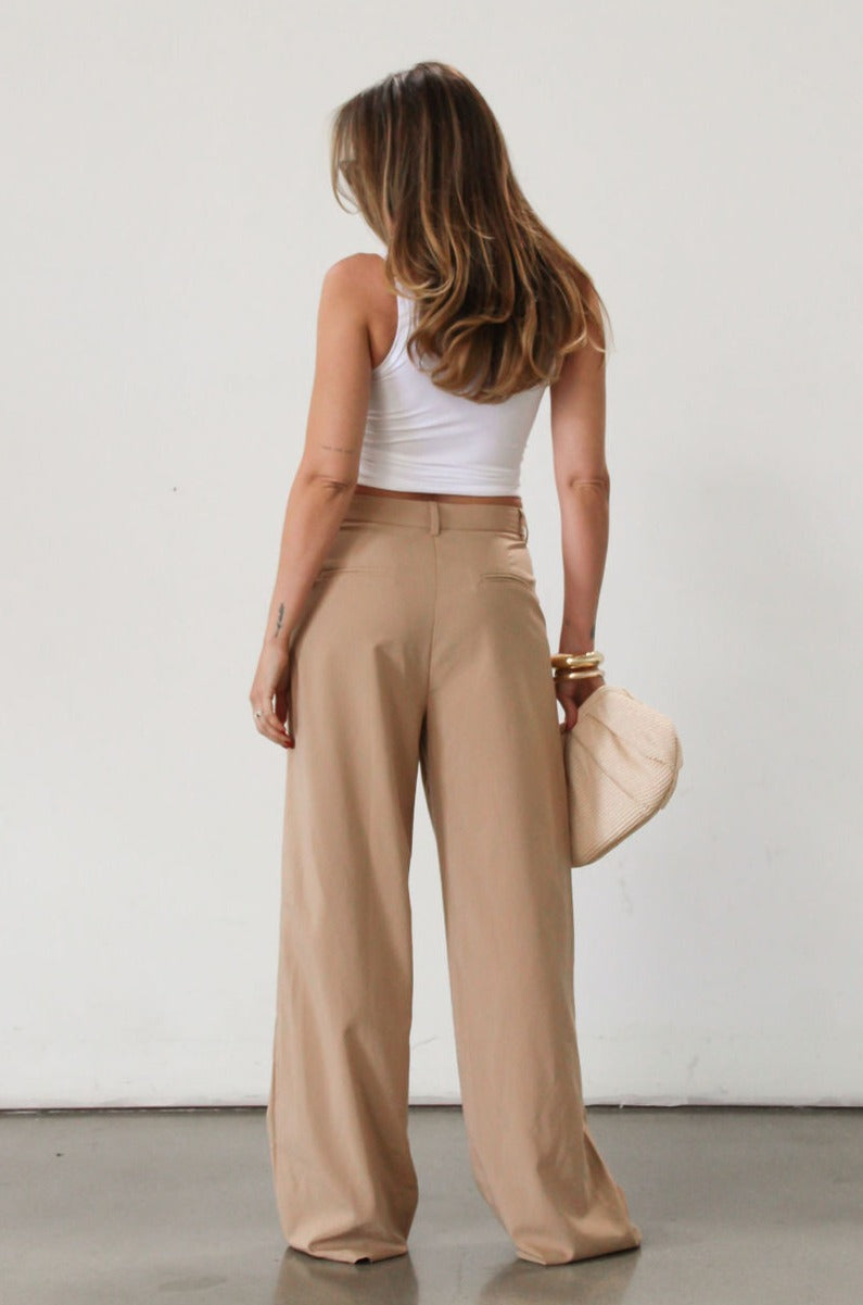 Woven wide leg pant. Hook and eye and zipper fly. Side pockets. Unlined. Tan pants. Office pants. Business casual pants. Business professional pants.