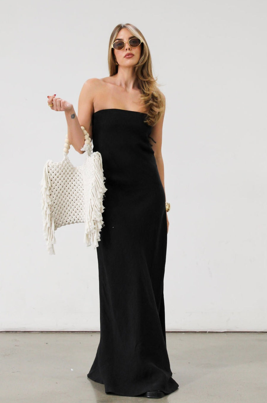 Linen woven maxi dress. Strapless neckline. Elastic back. Back zipper closure. Unlined. Black maxi dress. Black tie dress. Wedding guest dress. 