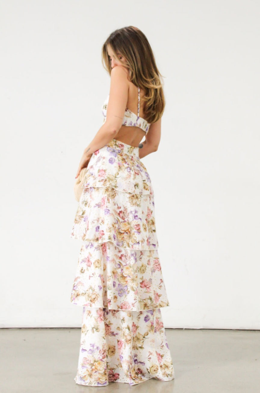 Floral printed eyelet woven tiered maxi dress. Adjustable straps. Front drawstring closure. Back cut out. Elastic back strap. Back hook and eye and zipper closures. Fully lined. Guest wedding dress. Floral dress. Coquette dress.
