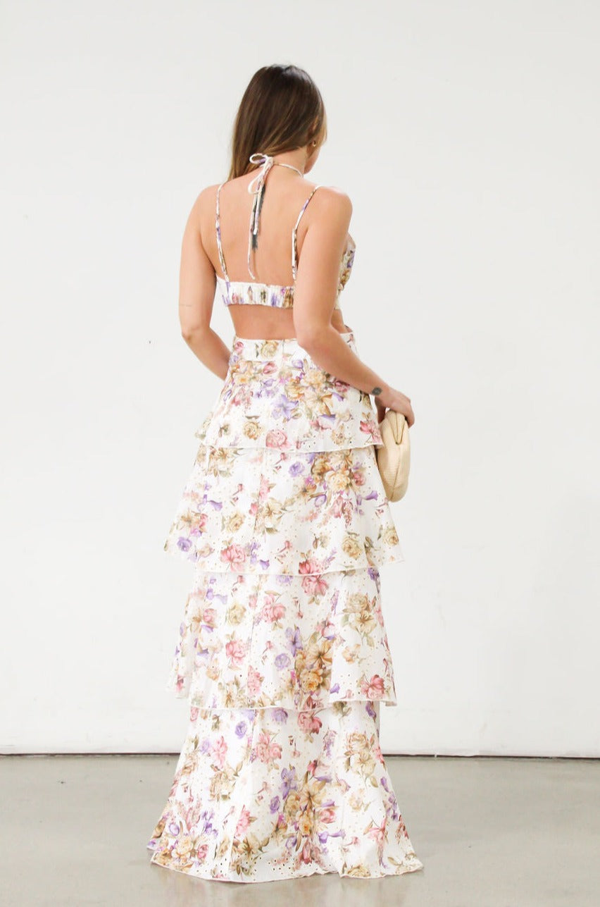 Floral printed eyelet woven tiered maxi dress. Adjustable straps. Front drawstring closure. Back cut out. Elastic back strap. Back hook and eye and zipper closures. Fully lined. Guest wedding dress. Floral dress. Coquette dress.