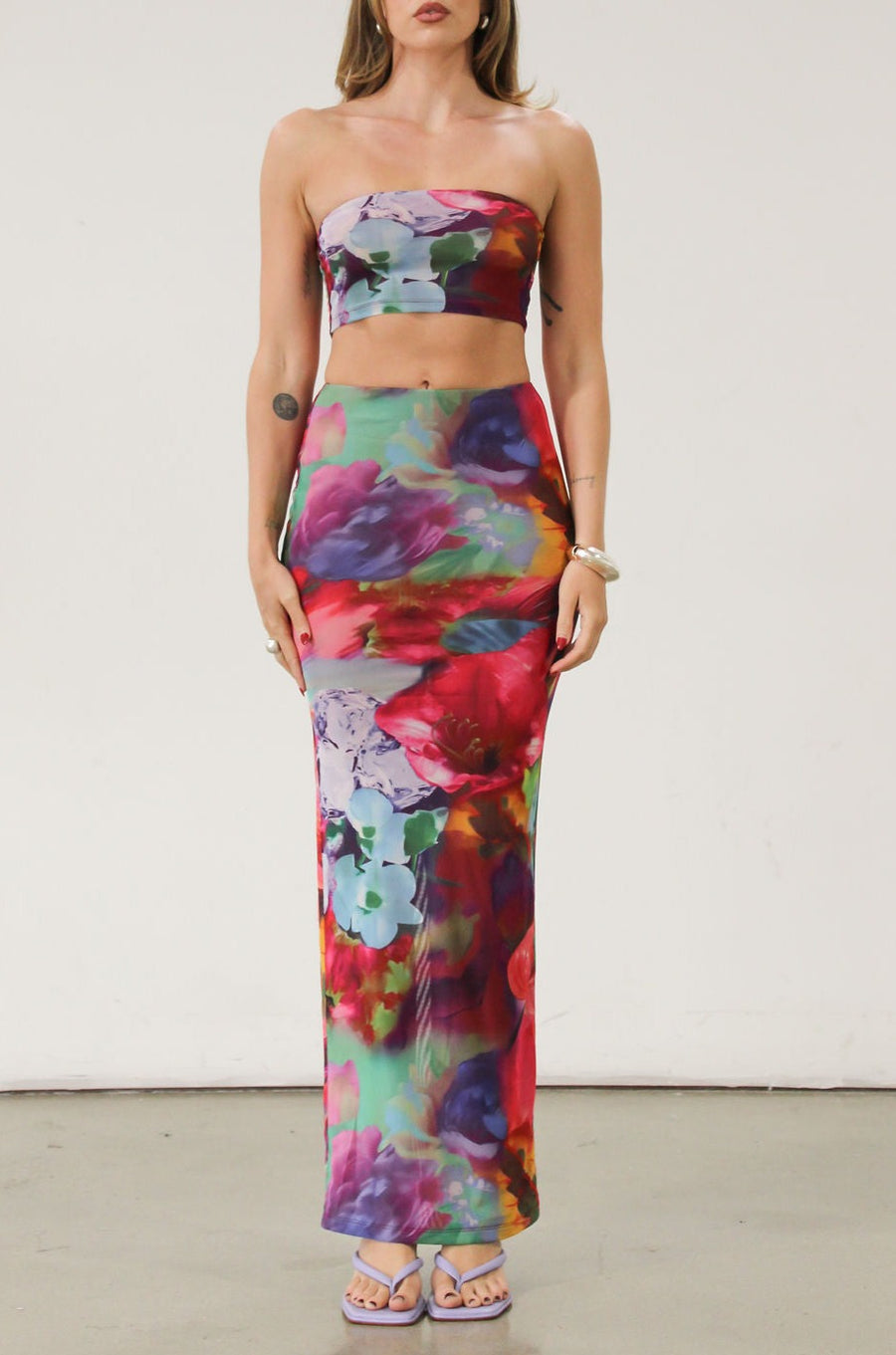Printed knit mesh bandeau. Elastic neckline. In we rubber grip lining. Fully lined.Printed knit mesh maxi skirt. Elastic waist. Tie Dye dress set. Tube top dress. Strapless dress set.