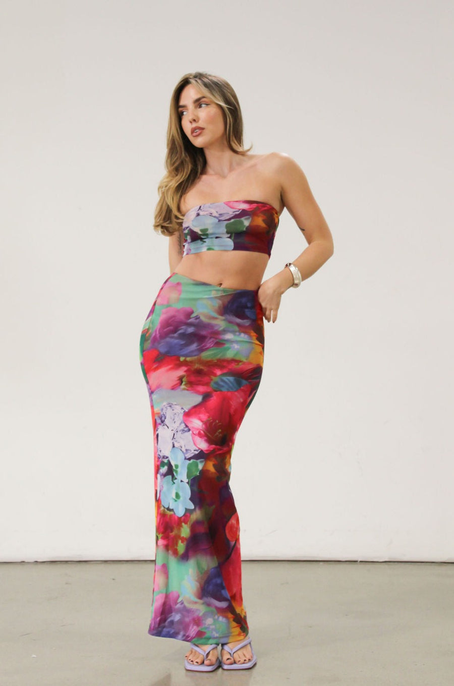 Printed knit mesh bandeau. Elastic neckline. In we rubber grip lining. Fully lined.Printed knit mesh maxi skirt. Elastic waist. Tie Dye dress set. Tube top dress. Strapless dress set.