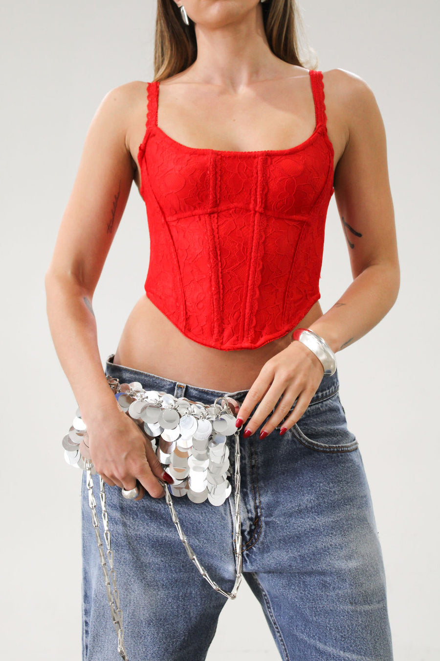 Knit lace bustier top. Adjustable straps. Boning in bodice. Back hook and eye closures. Fully lined. Going out top. Red tank top. Red bustier top. Red corset top.